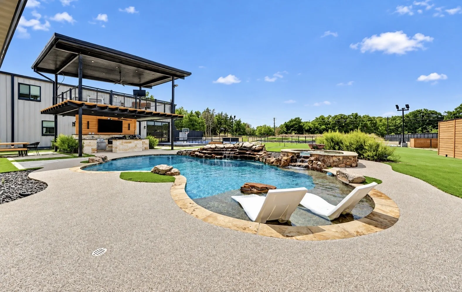 Pool and spa with waterfall feature