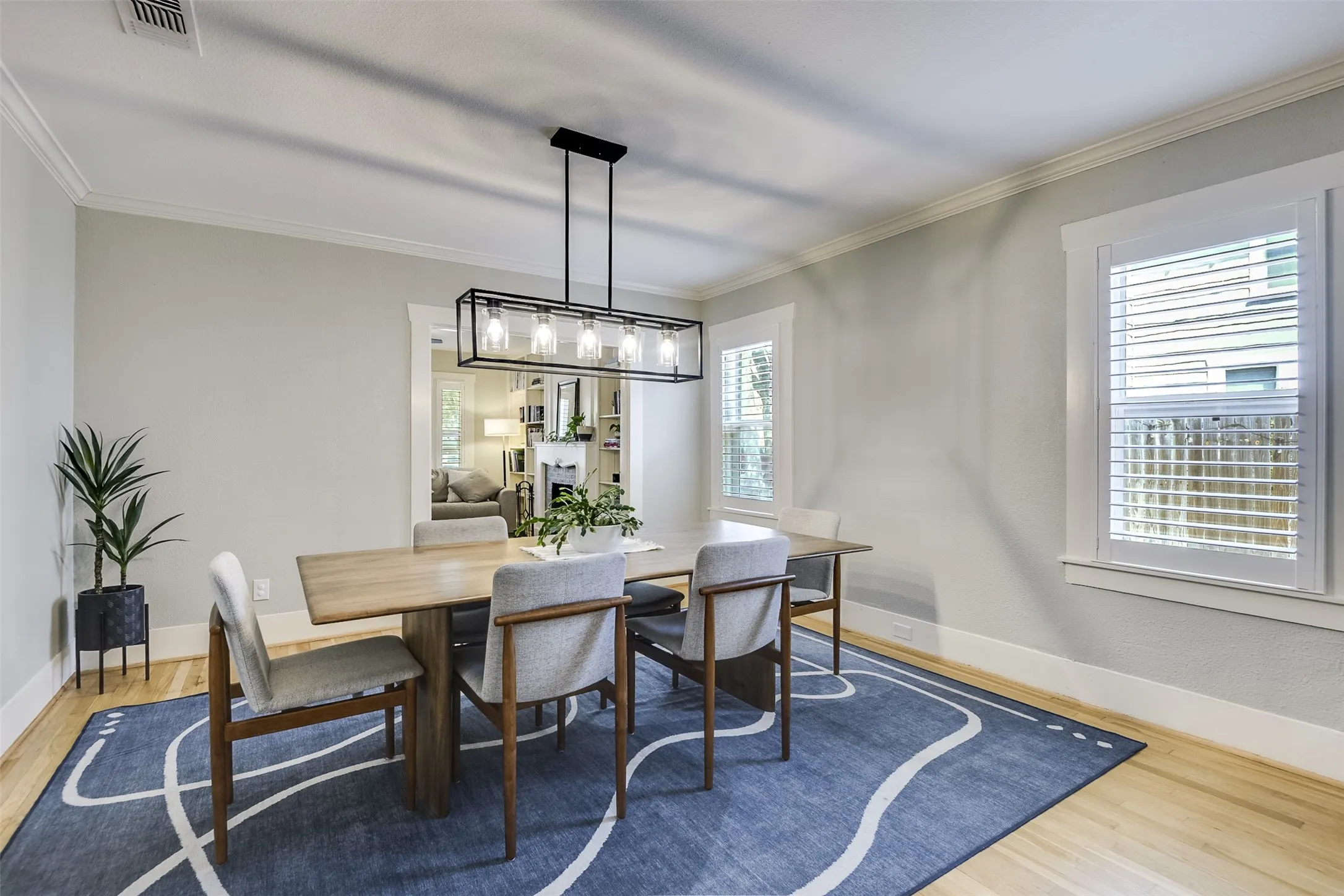 With the holidays just around the corner, this inviting dining room is ready to welcome a crowd.  The gleaming wood floors add warmth and elegance complementing a polished presentation.  It's the ideal setting for family and friends.