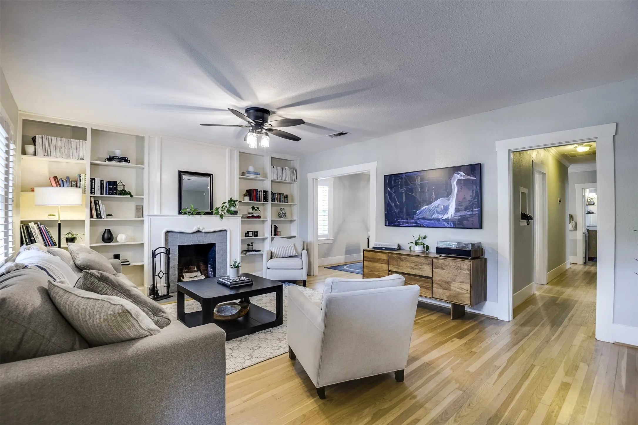 Bright, open and beautifully connected, generously proportioned rooms set the tone.  Restored original hardwood floors and vintage trims celebrate its timeless character.  Don't miss the charming vintage phone stand in the hallway.