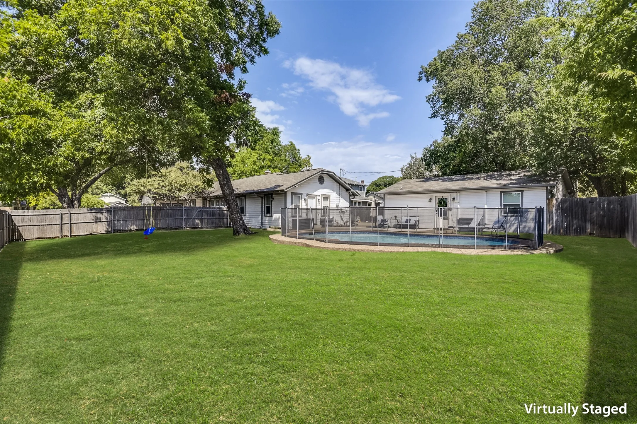 Looking back toward the house reveals your own private retreat with ample space for tons of family fun.  You could set up a mean croquet course, volleyball game or badminton match.  You decide.