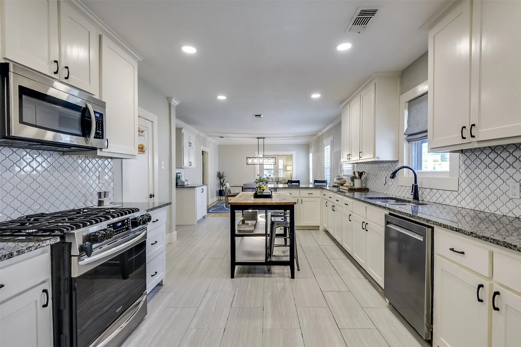 It is impossible not to be captivated by the luxurious enhancements of this stylish cook's kitchen where expansive miles of gleaming prep space, abundant storage, and impressive built-in appliances create an exceptional culinary setting.