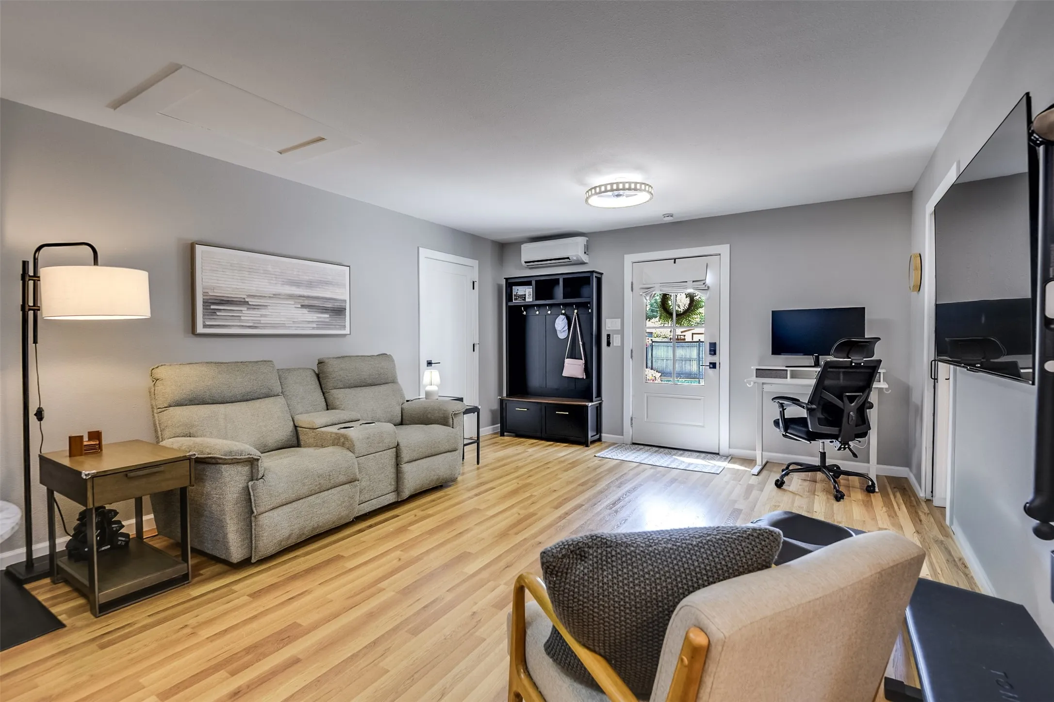 Spacious great room serves as the heart of this versatile multi-use ADU, served by vinyl laminate wood-styled flooring that continues throughout.  This charming space sets the tone for a comfortable second residence.