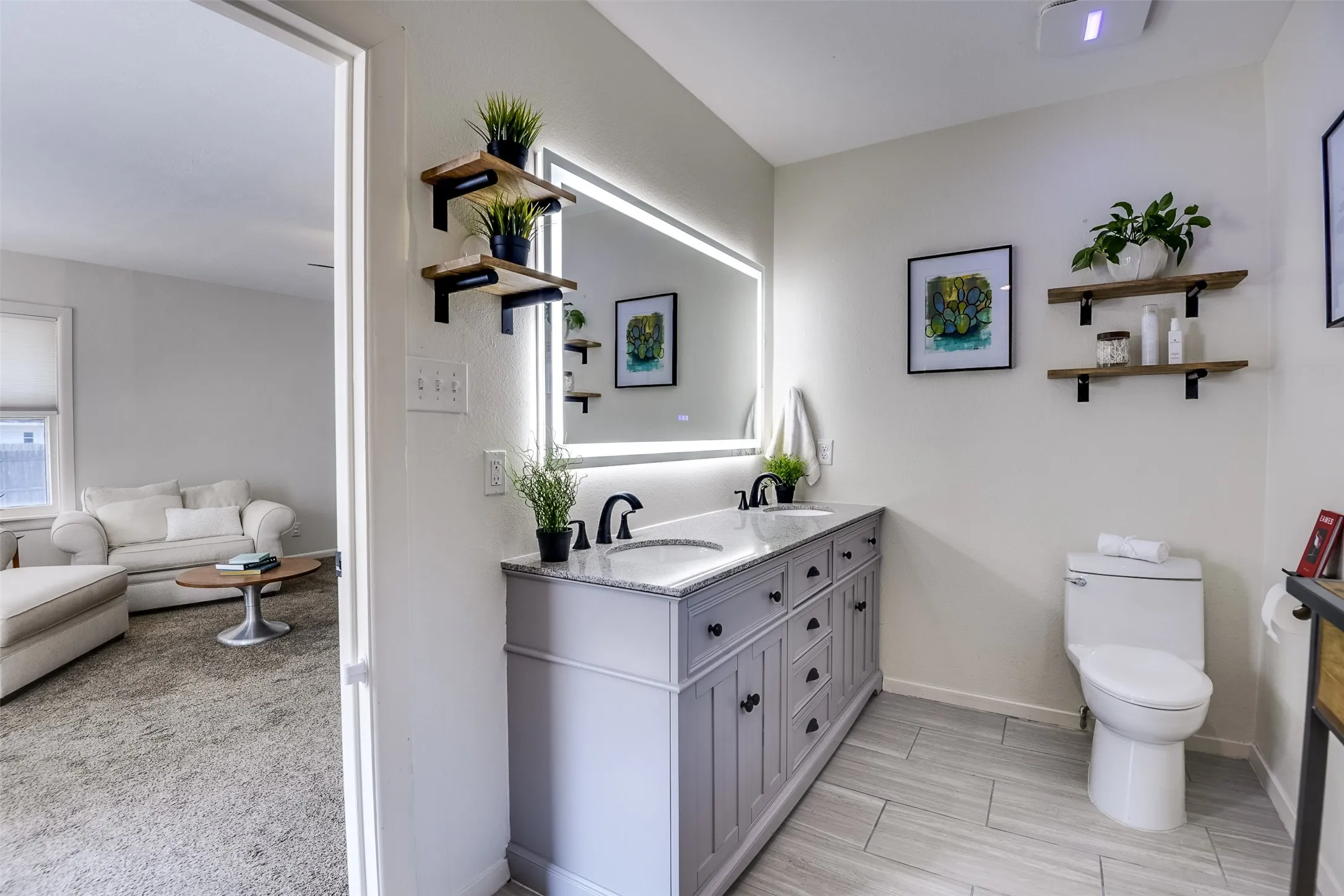 Dual vanities beautifully compliment the backlit, anti-fog mirror.  Floating shelves add a stylish touch while providing the perfect spot for plush towels, favorite perfumes and everyday sundries.  Not shown in any of the photos is the impressive, oversized walk-in closet.