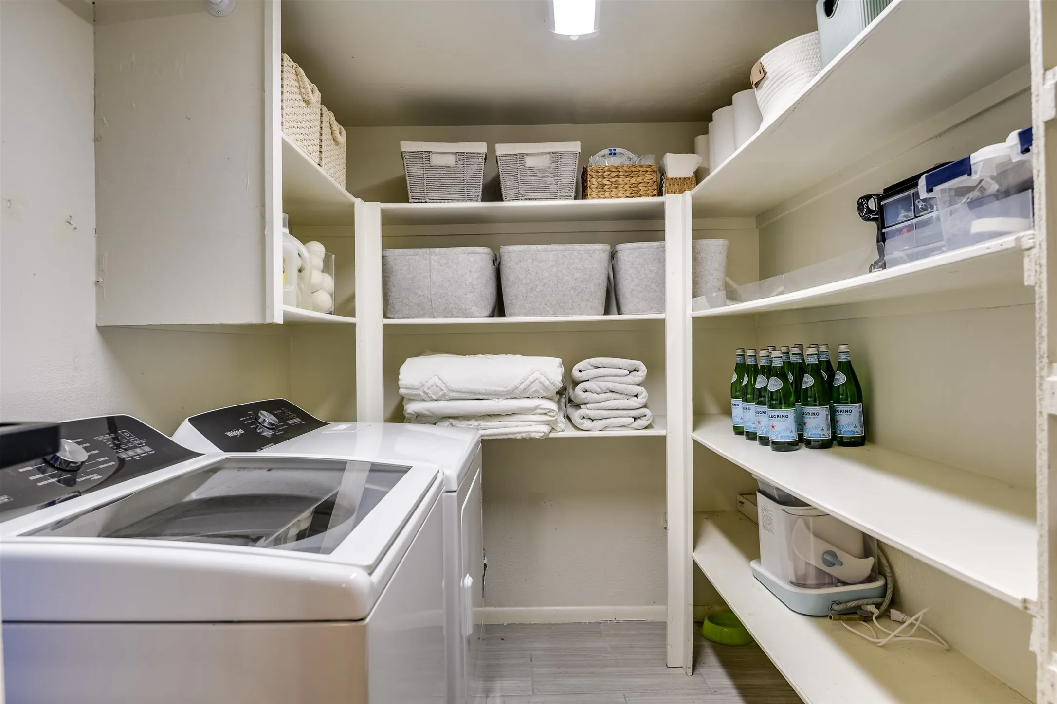 Storage galore!  Versatile utility room can easily double as a secondary pantry, linen closet, appliance pantry or mega storage closet.