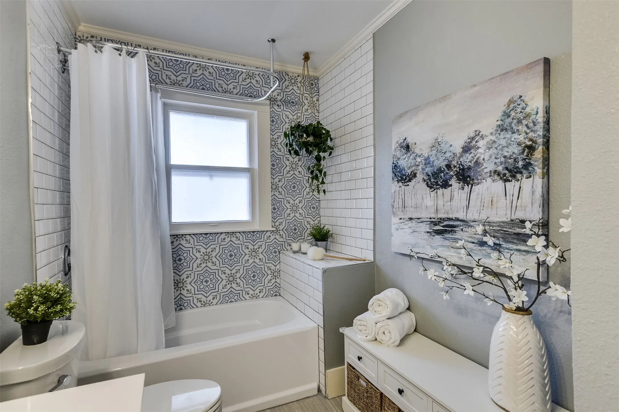 Additional view showcases the playful mix of tile patterns, creating a fresh and modern look with a whimsical touch.  For added convivence, a nice sized linen closet is just out of view.