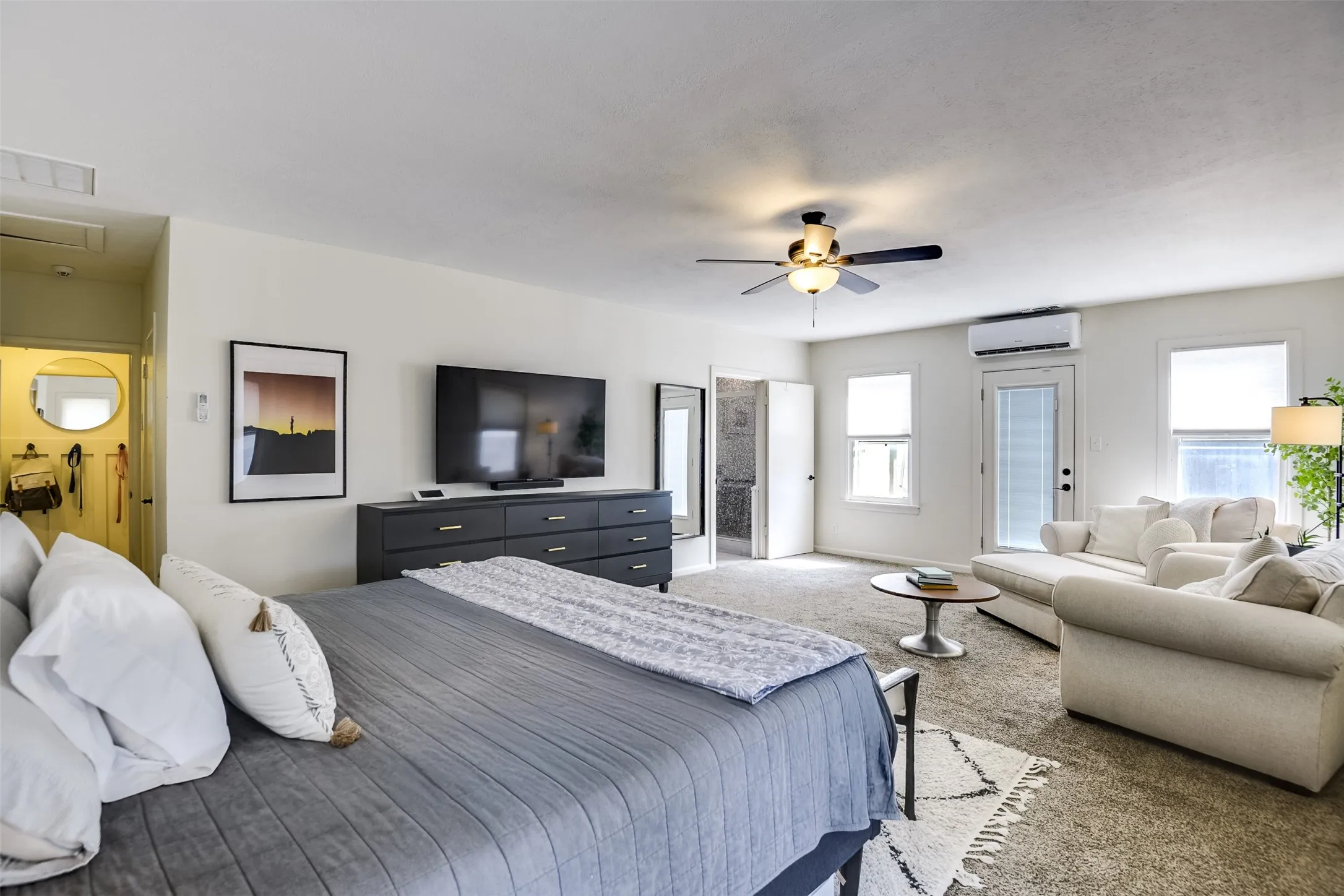 Additional view showcases its impressive scale and versatility.  Expansive wall space provides the perfect canvas for your personal decorating style.  The dual window and pass-through door open directly into the spacious back yard and inviting pool.