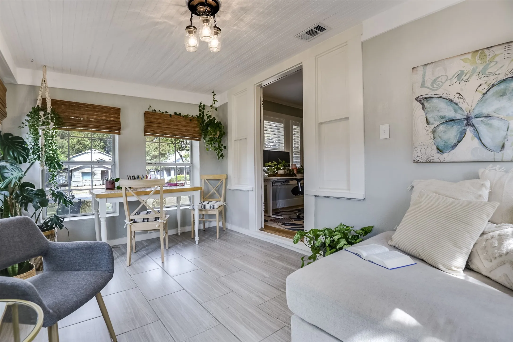 A reverse view of this inviting sunroom reveals its exceptional flexibility, offering a bright, versatile space ready to adapt to your lifestyle.  Imagine it as a fabulous playroom where little ones can spread out, create and enjoy their own special space.