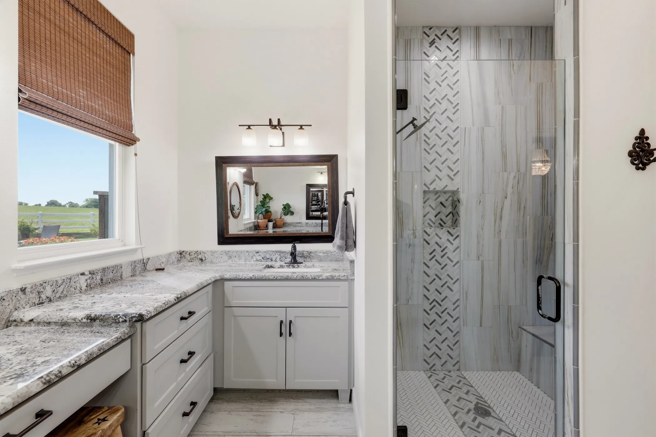 Walk-in shower with glass enclosure, custom tile work, and built-in bench