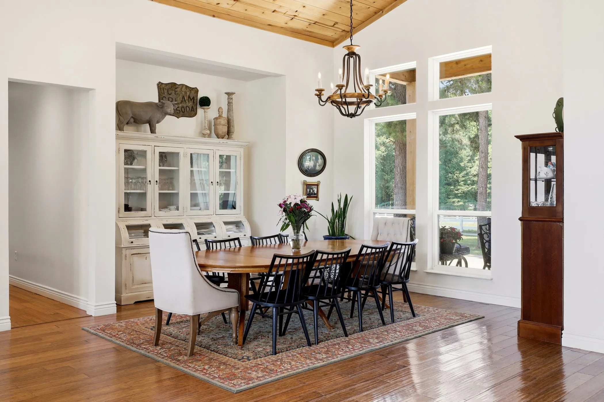 Vaulted wood-paneled ceiling with a chandelier