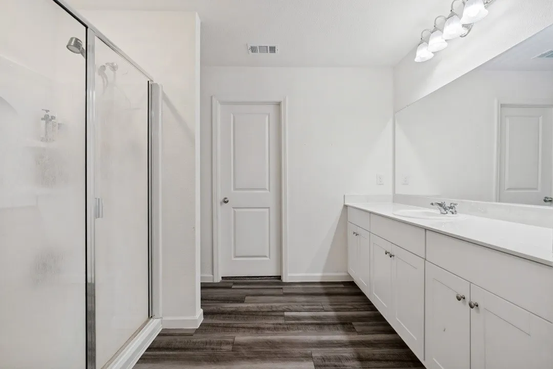 Walk-in shower with clear glass enclosure