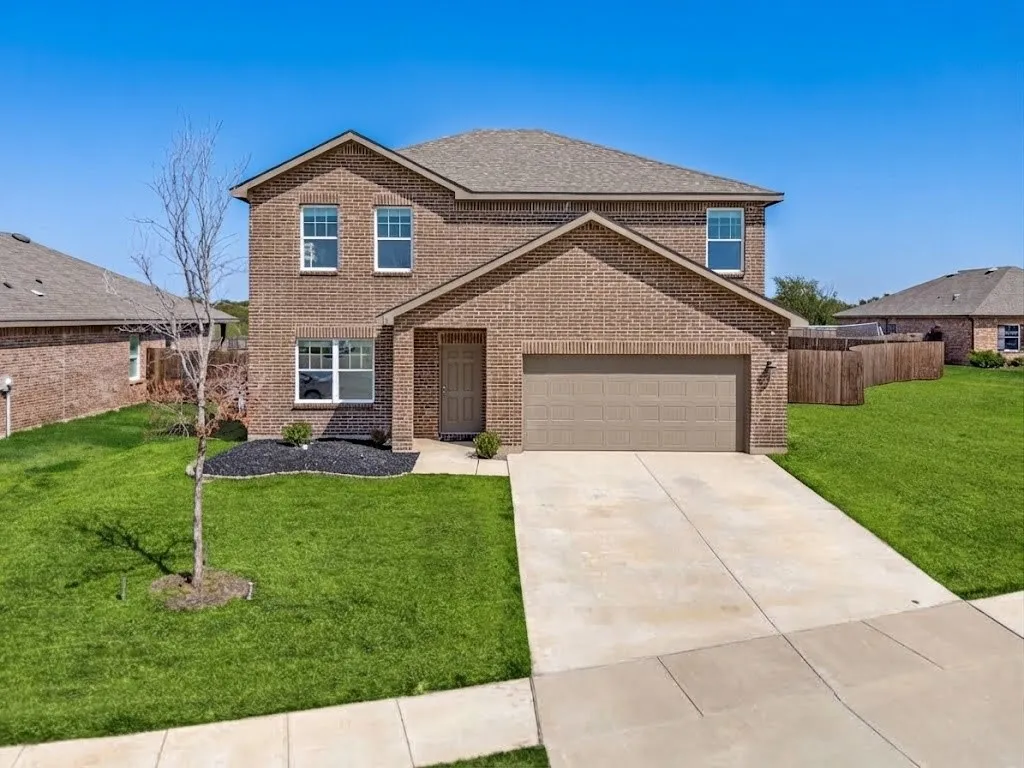 Brick exterior with a two-car garage