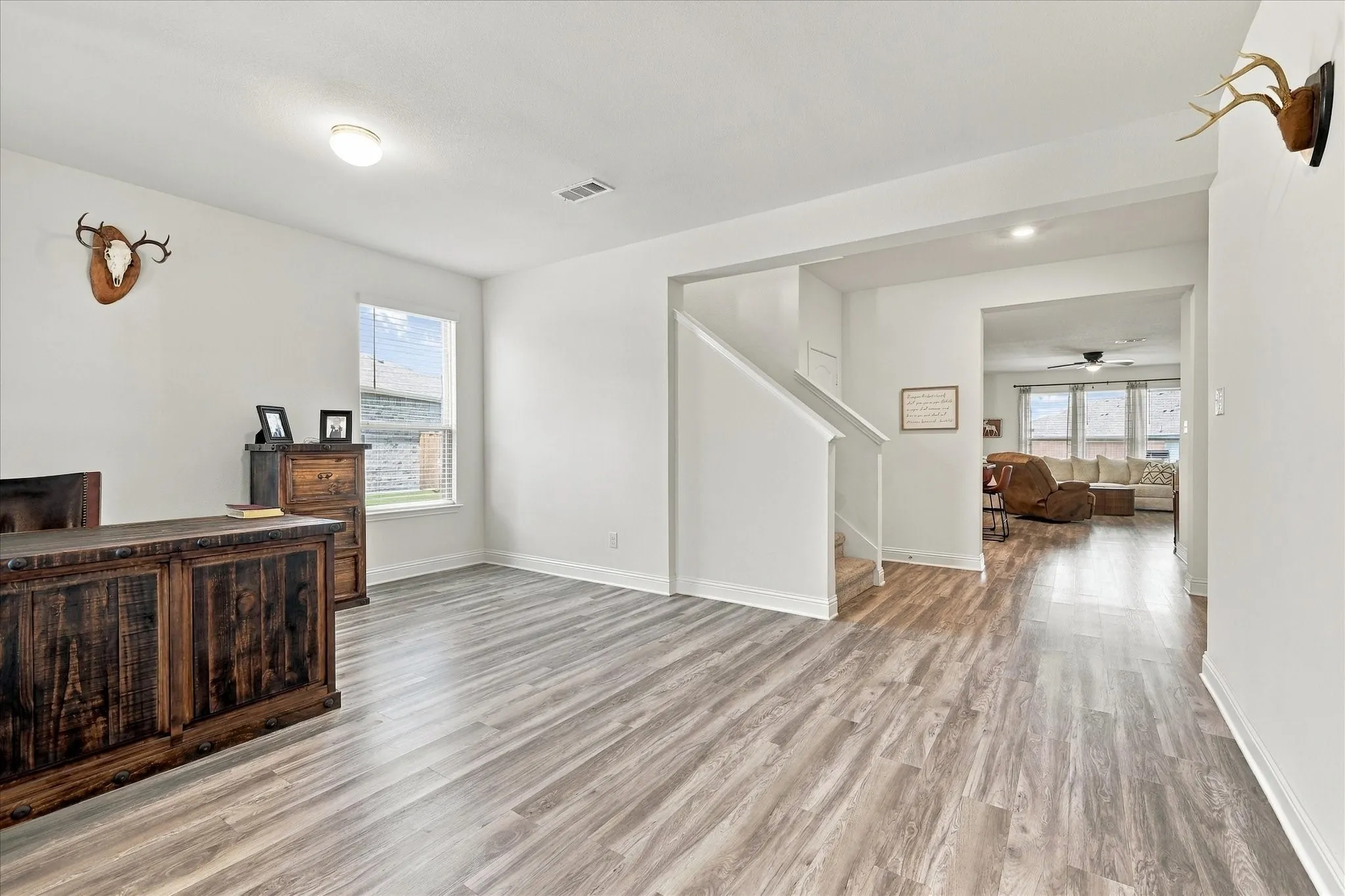 Front room currently being used as an office, but could be a dining area, second living room, or many other options.