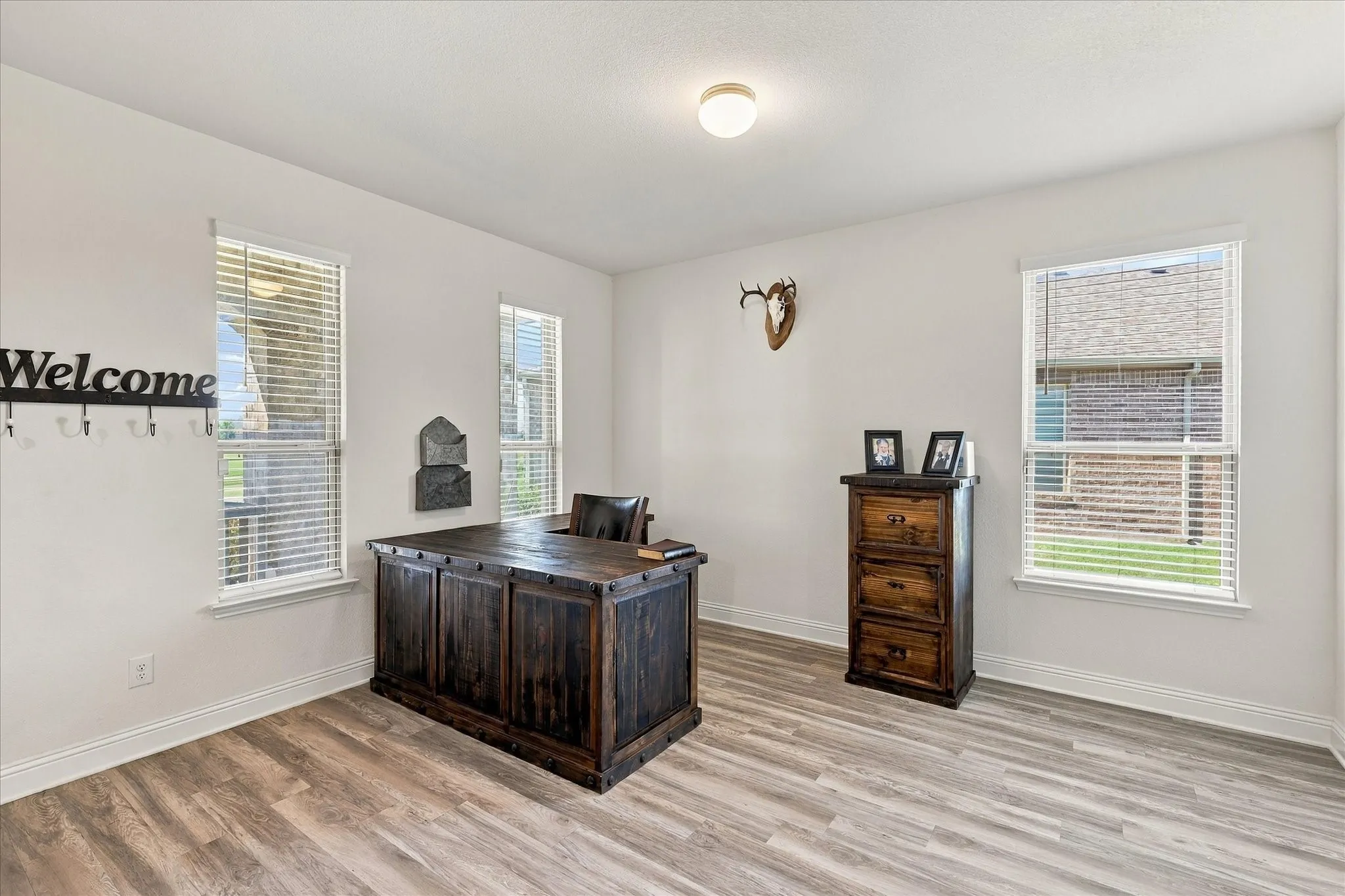 Front room currently being used as an office, but could be a dining area, second living room, or many other options.