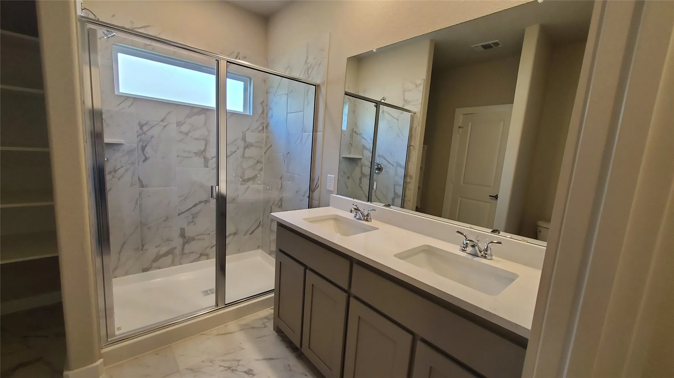 Dual vanity with undermount sinks and chrome fixtures