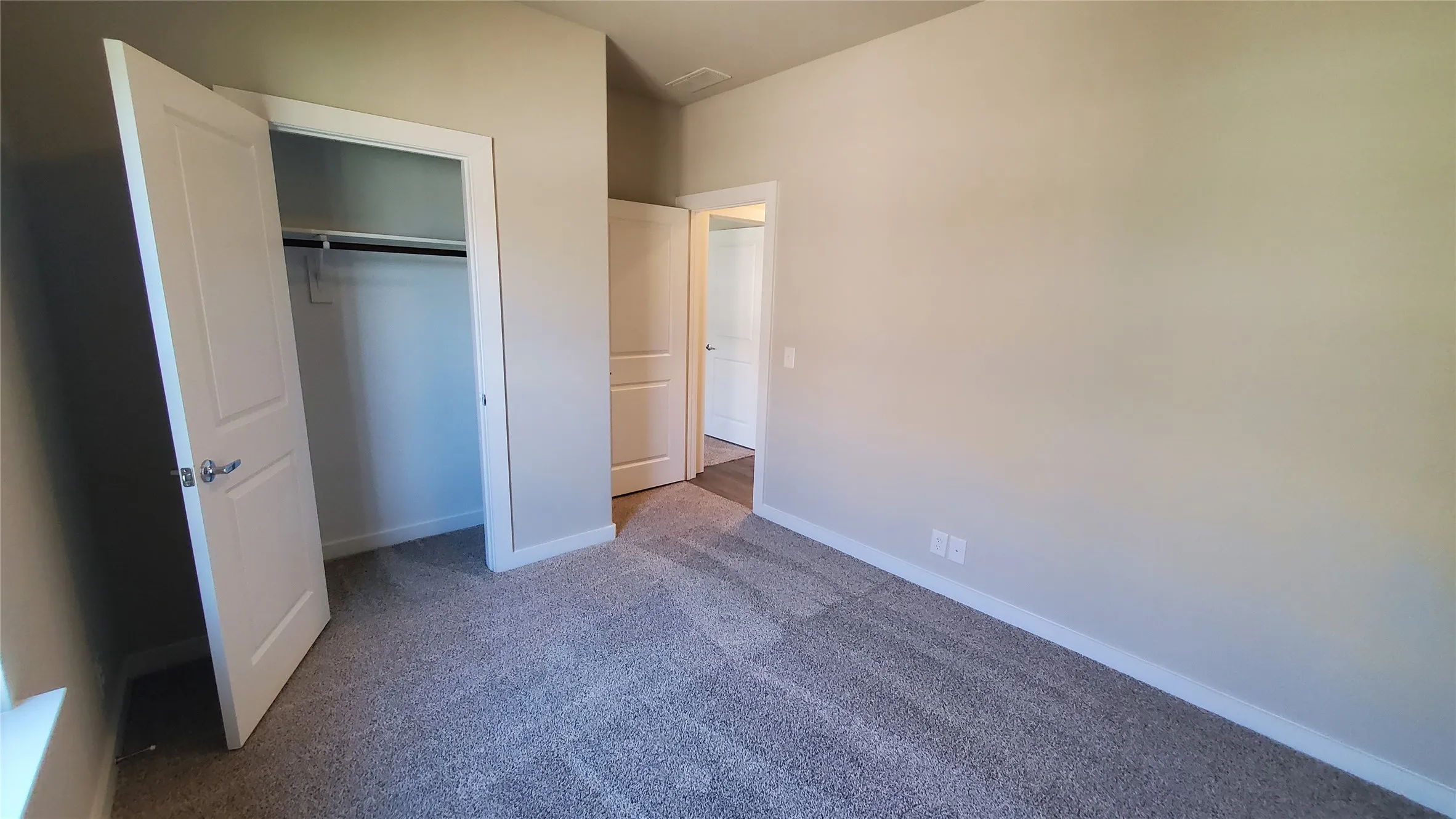 Neutral wall color with white trim