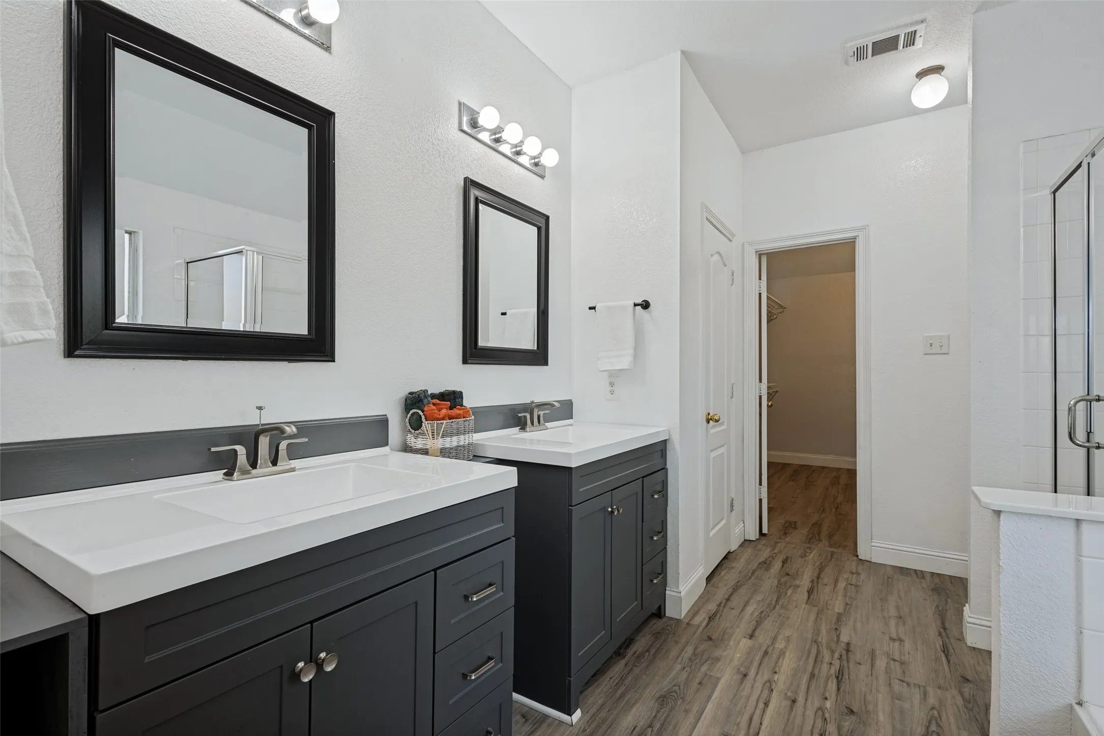 Dual vanity, separate shower, tub and large walk-in closet