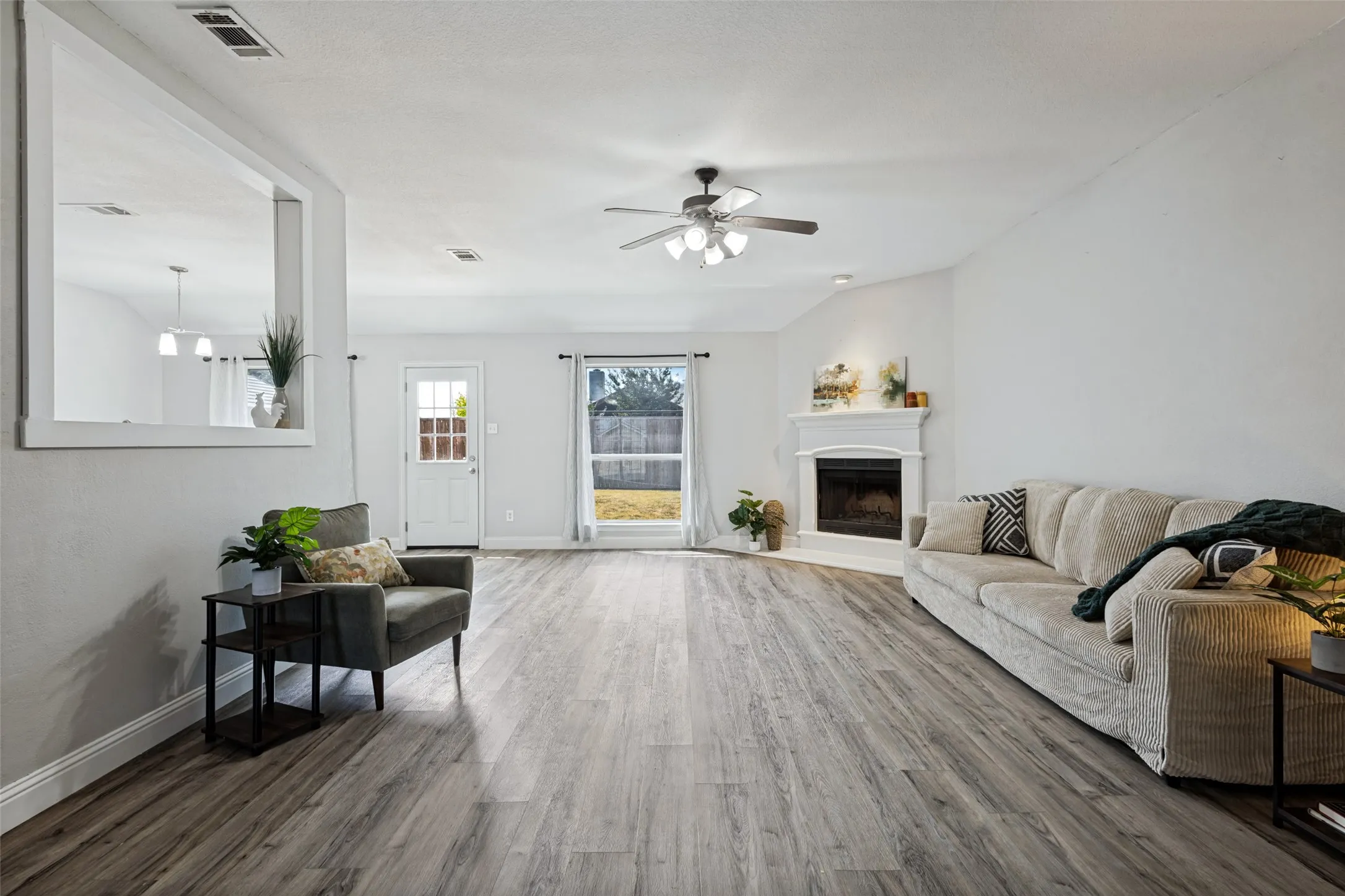 Light and bright, ceiling fan and door to backyard