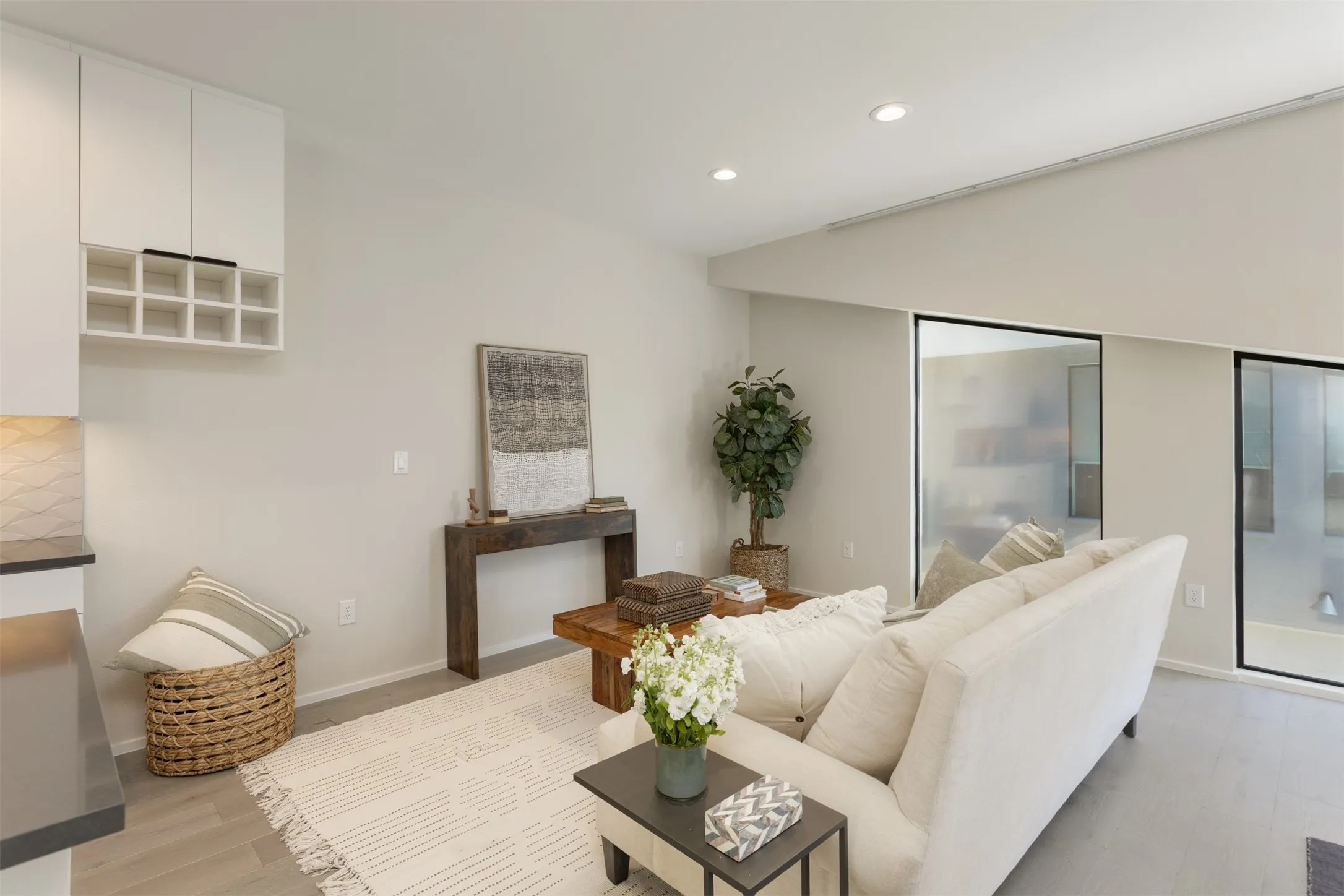 Living room with recessed lighting and light wood-style flooring