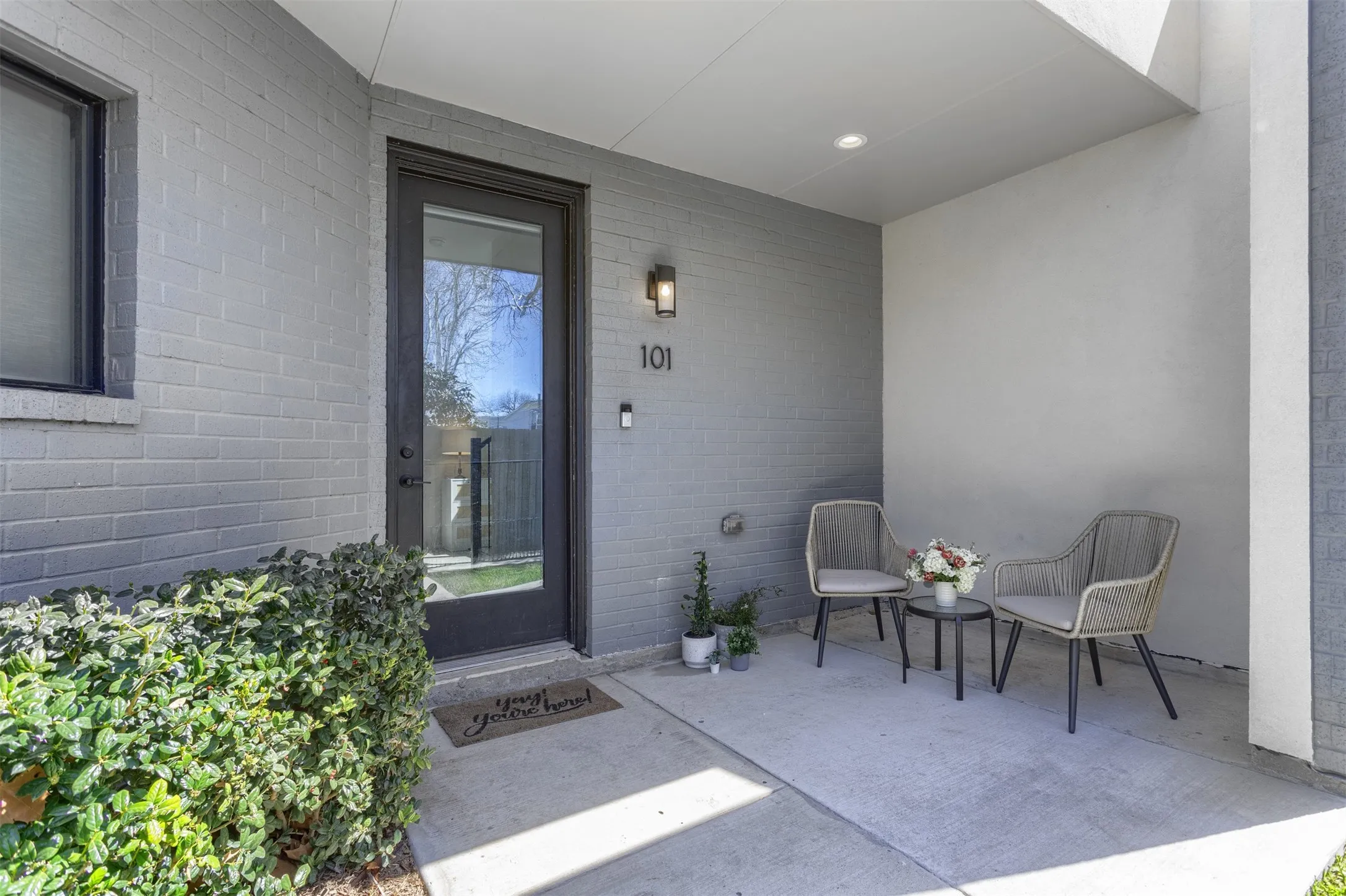 View of exterior entry featuring brick siding