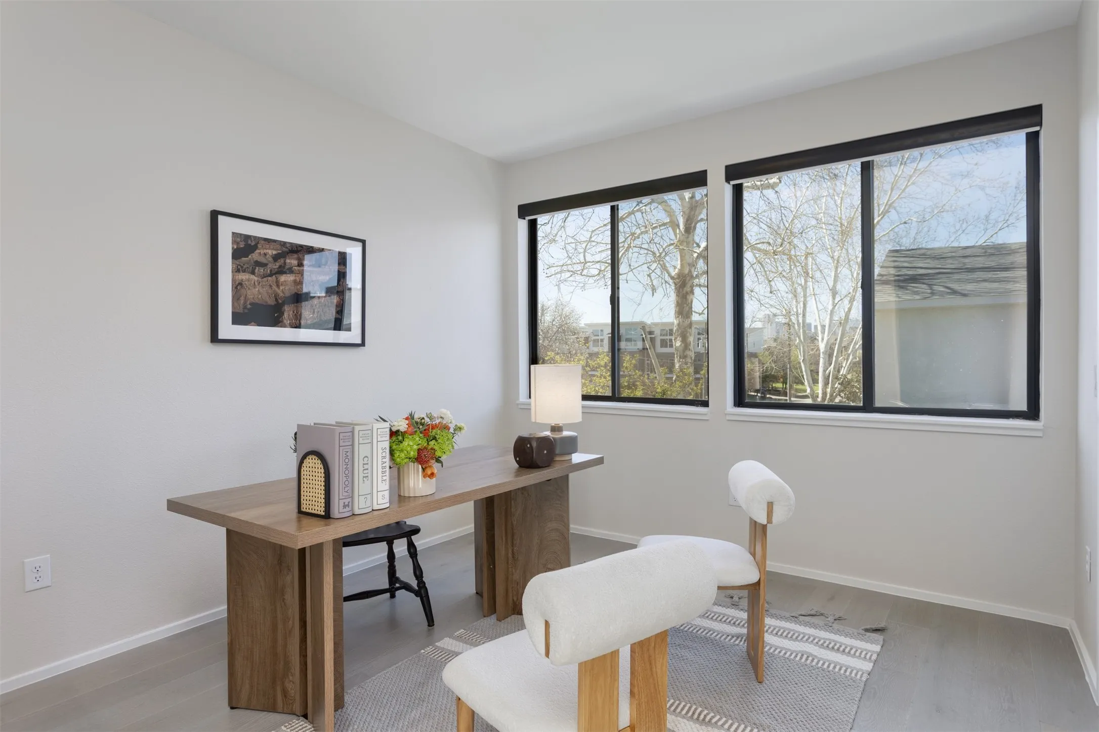 Home office featuring baseboards and light wood-style flooring