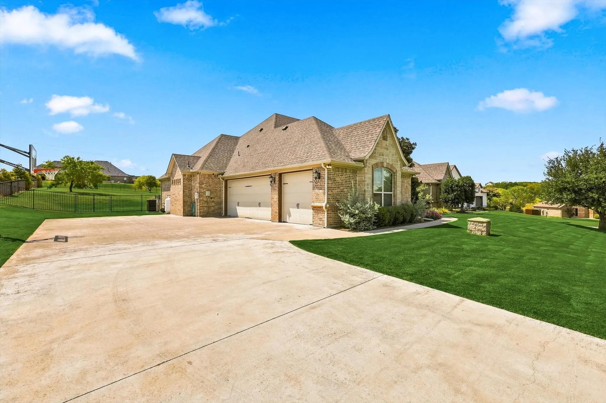 3-car garage and driveway with extra parking