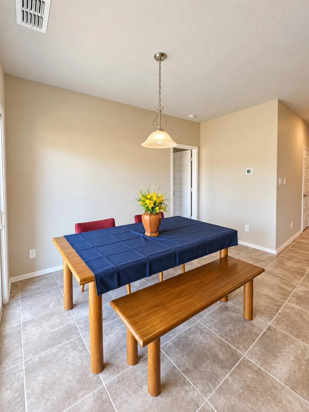 Recessed lighting, tile flooring, and a pendant light fixture