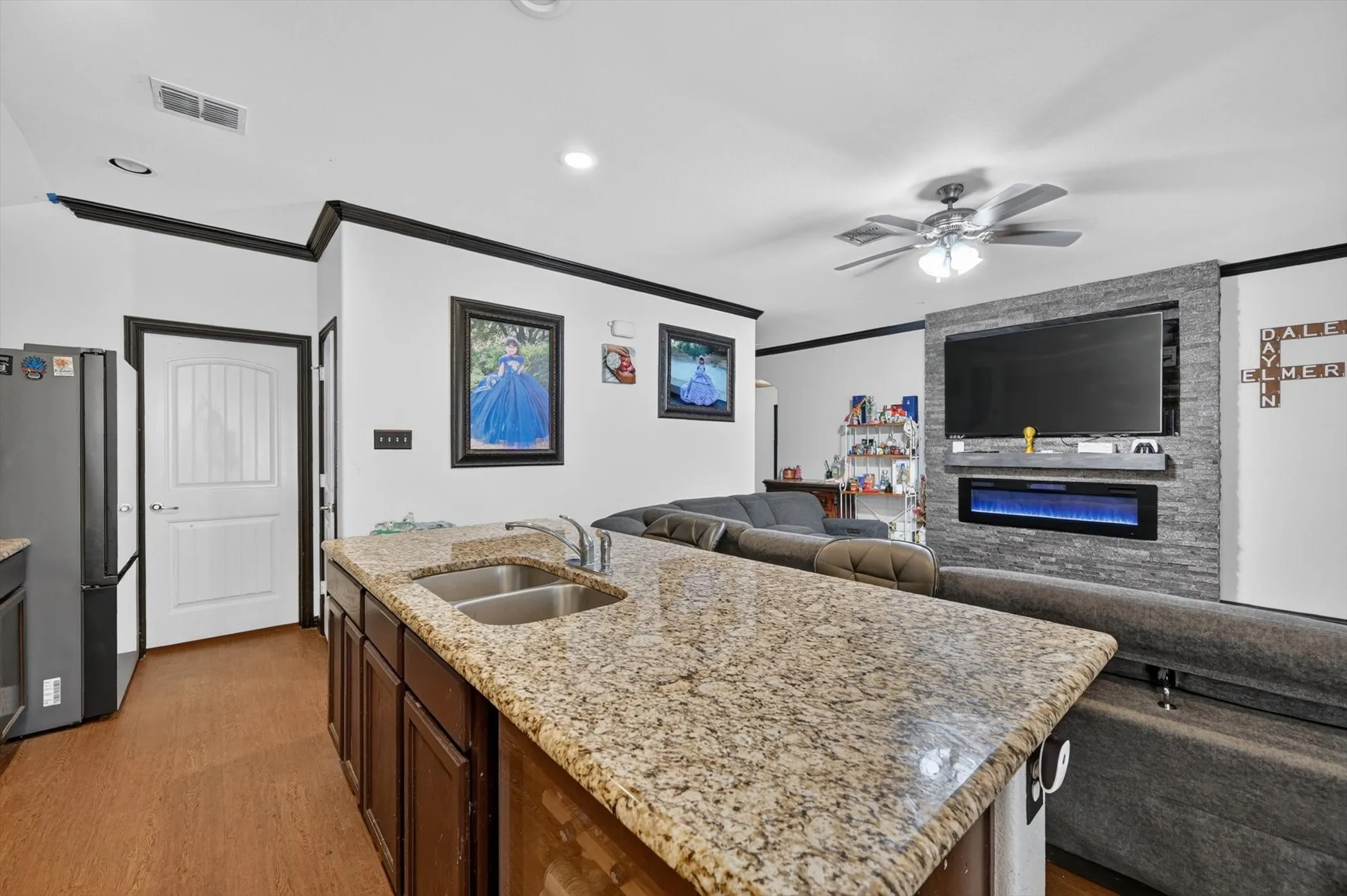 Kitchen island with a double basin sink and granite countertop