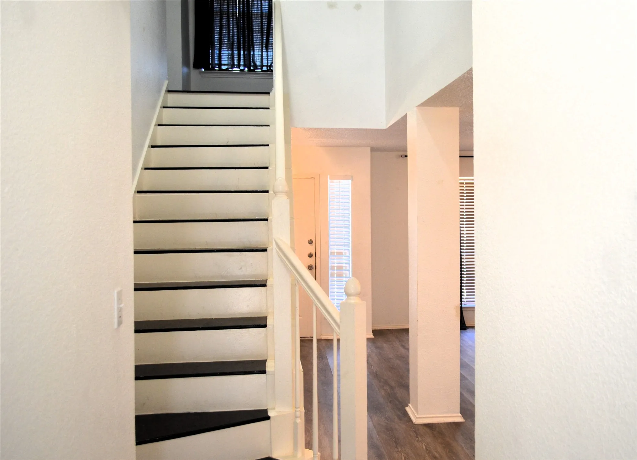 Staircase with white risers and dark treads