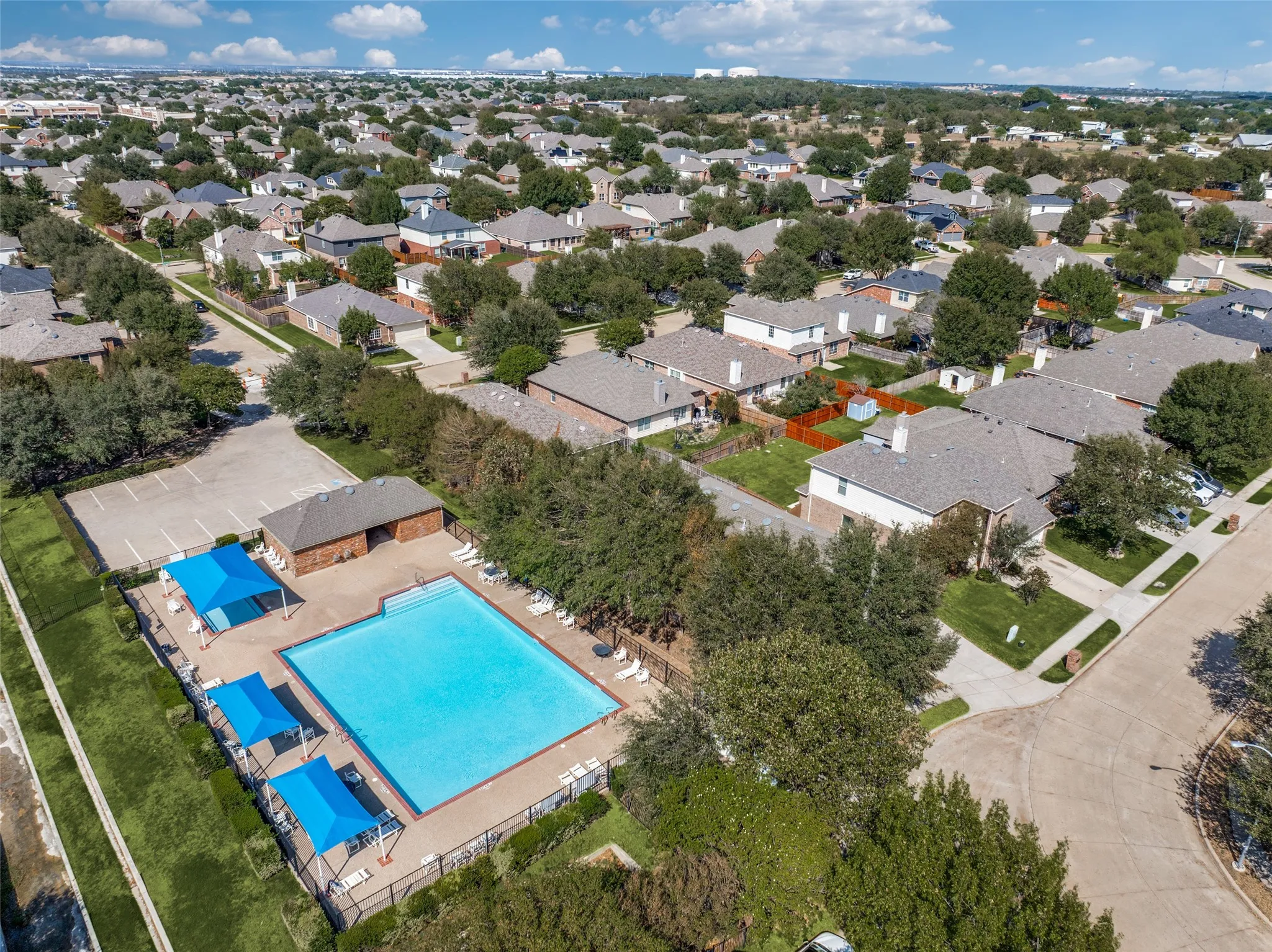 Spend warm Texas days one house down from the community swim center!