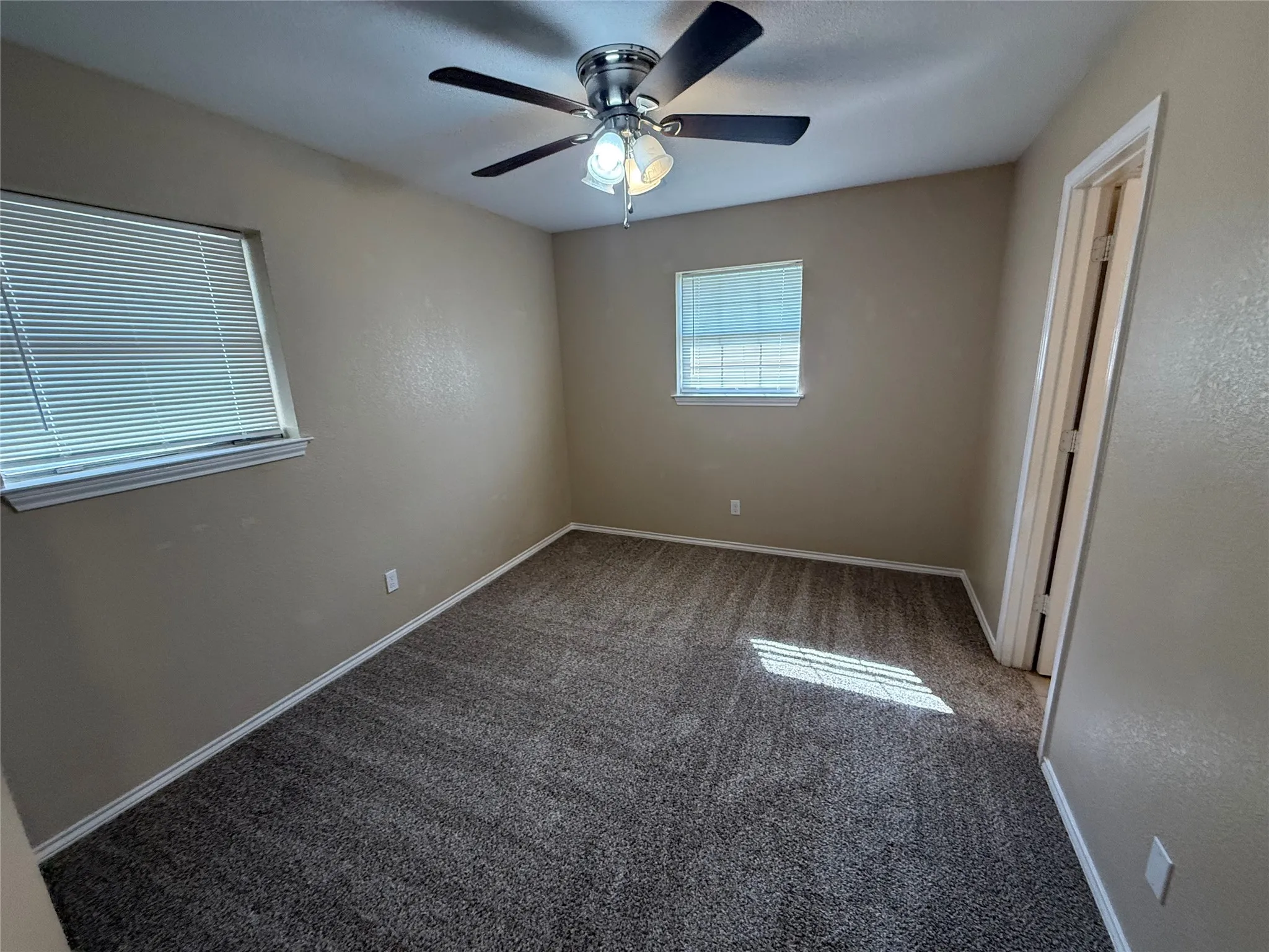 Wall-to-wall carpeting and neutral wall tones