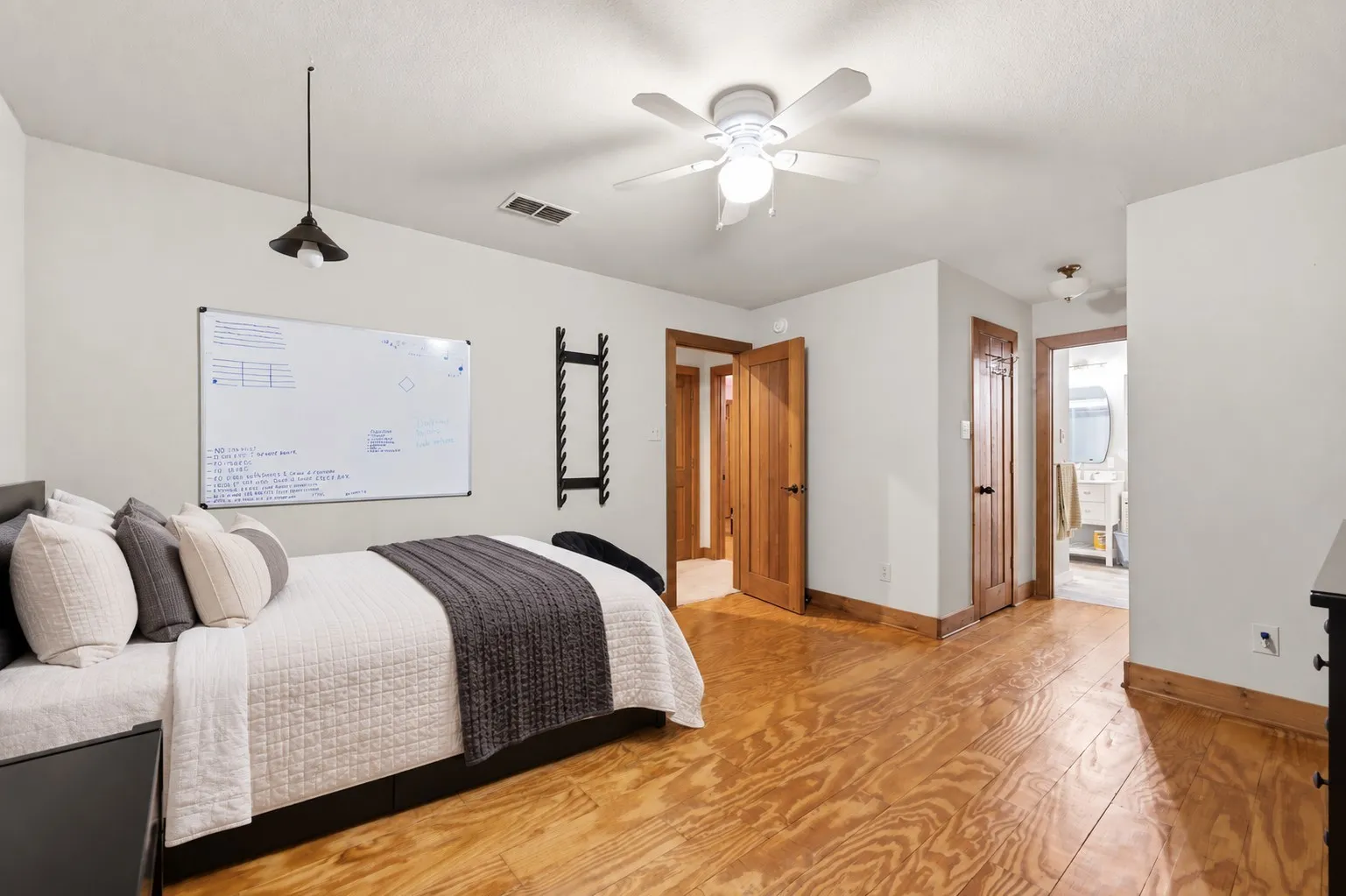 upstairs bedroom with balcony
