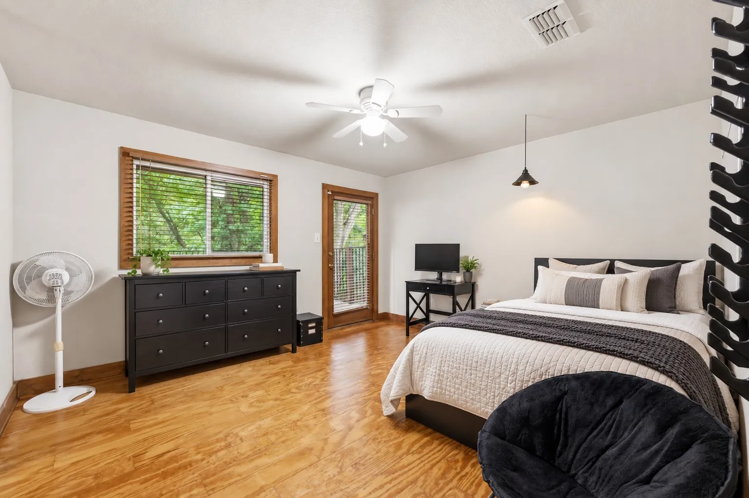 upstairs bedroom with balcony