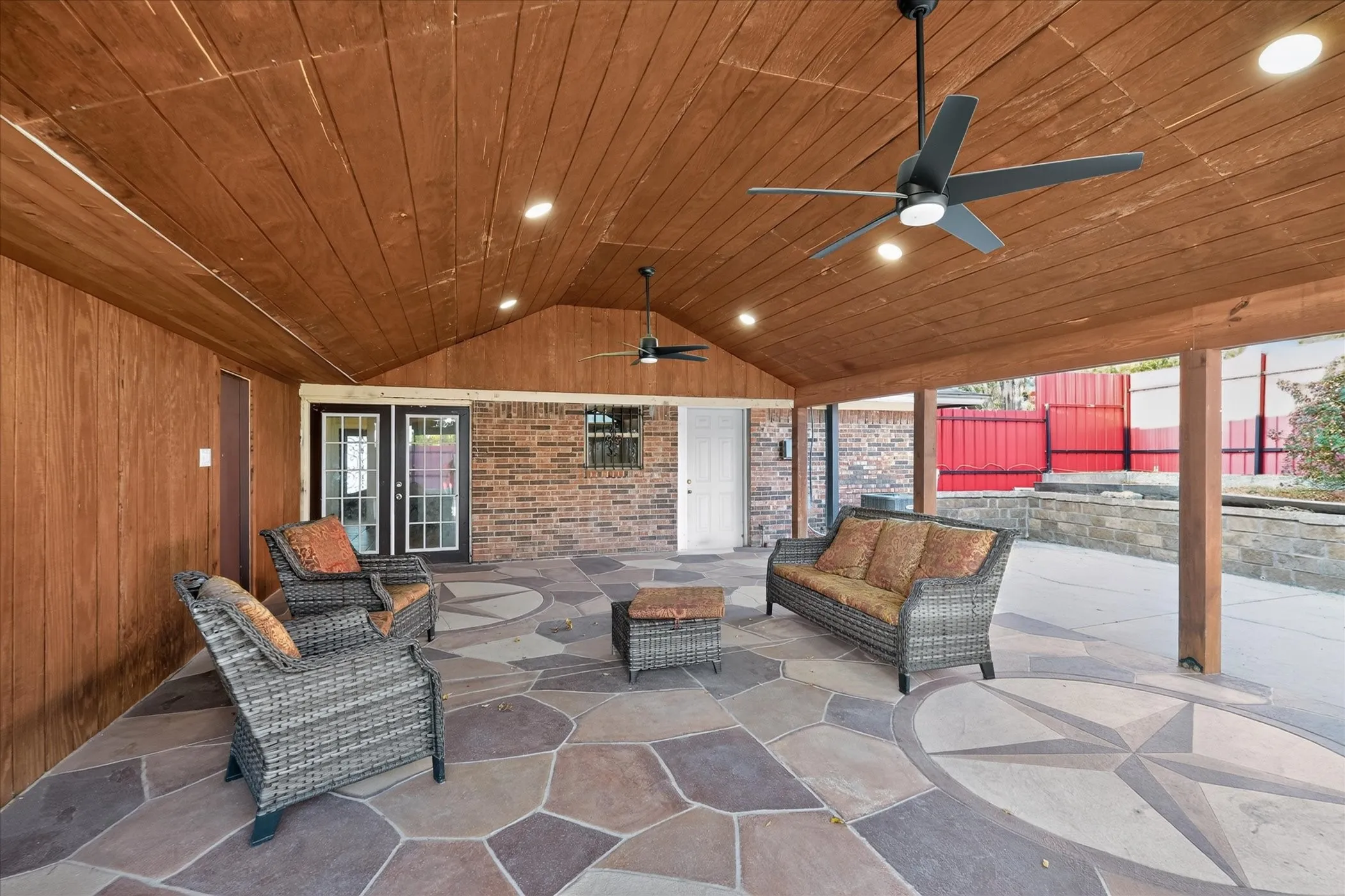 Covered patio featuring a wood plank ceiling, recessed lighting, and dual ceiling fans