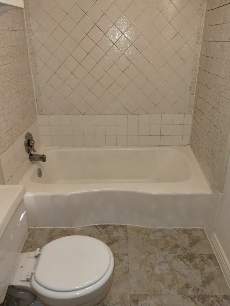 White bathtub with a chrome faucet
