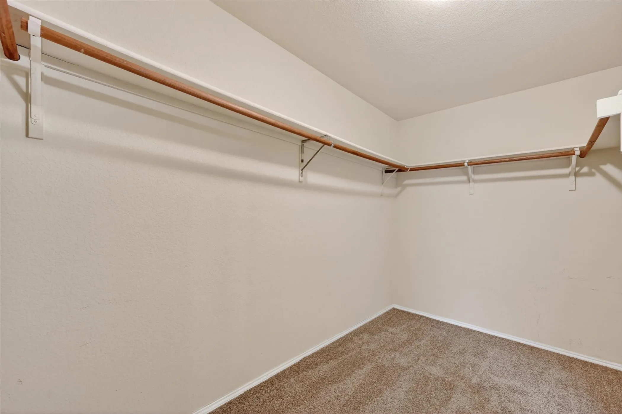 Integrated wood-finish closet rods and shelving system