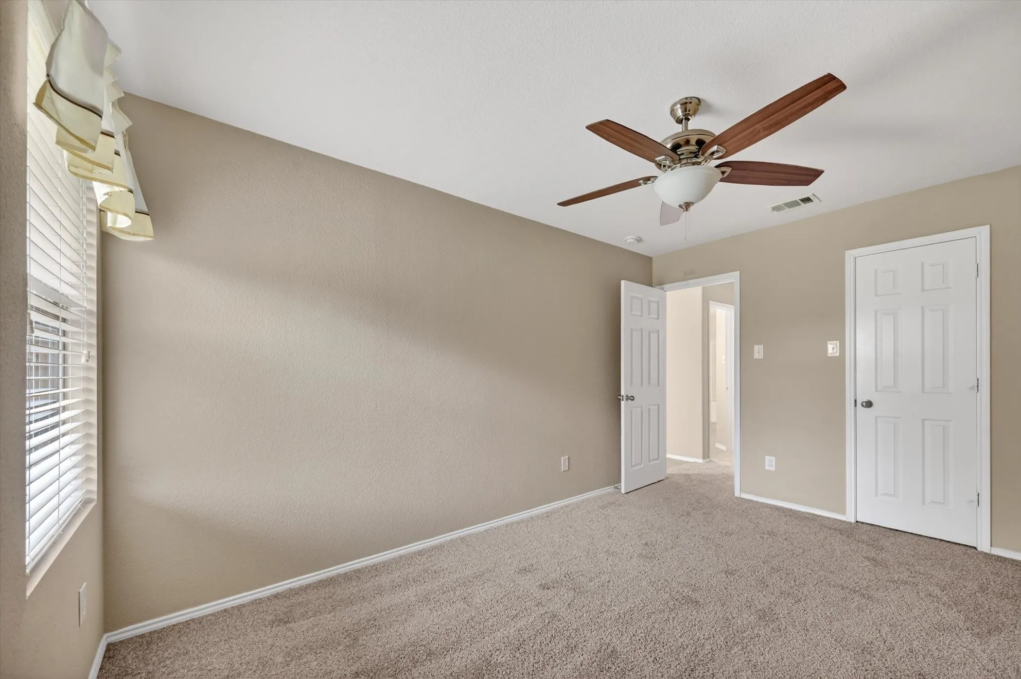 Bedroom # 4 Recessed ceiling fan with wood-finish blades, neutral-toned walls, and plush carpeting