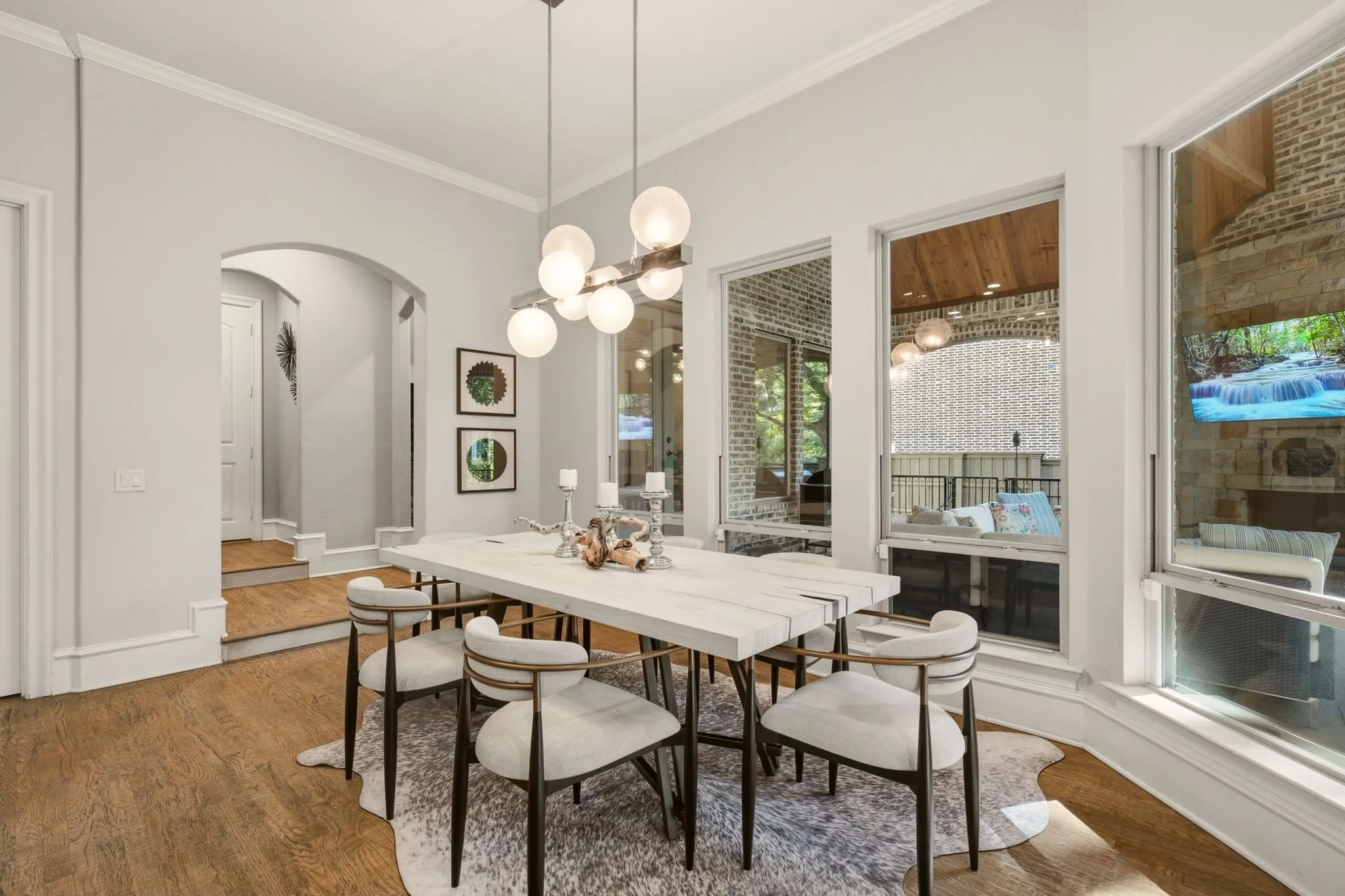 The inviting breakfast area just off the kitchen features rich hardwood floors and generous space for a six-to-eight-person dining table, creating an ideal setting for everything from casual family breakfasts to relaxed gatherings with guests.