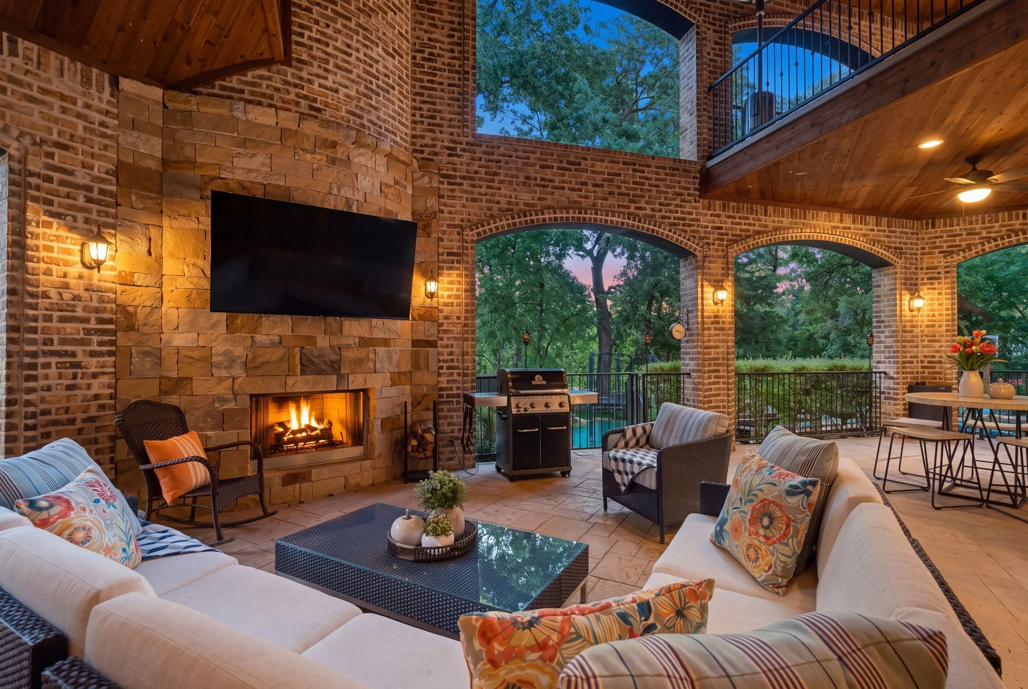 The expansive covered back patio is truly an extension of the home’s living space, designed for year-round entertaining and relaxed outdoor living. Three separate access points—from the grand front entry, living room, and primary suite—create an effortless connection between the interior and backyard retreat.