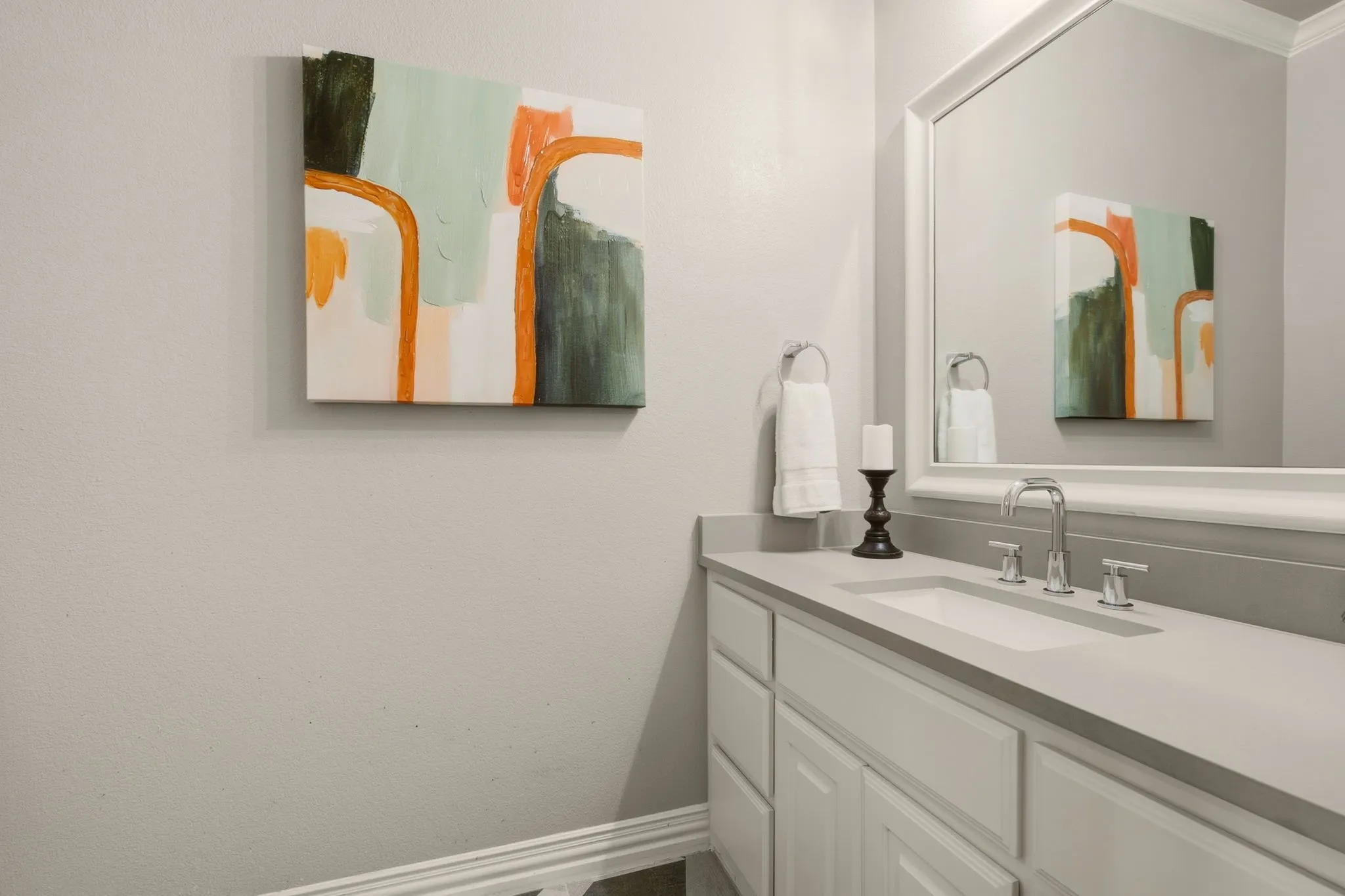 A private, recently renovated vanity area is thoughtfully designed with a built-in vanity and undermount sink, adding an elevated touch of convenience and functionality.
