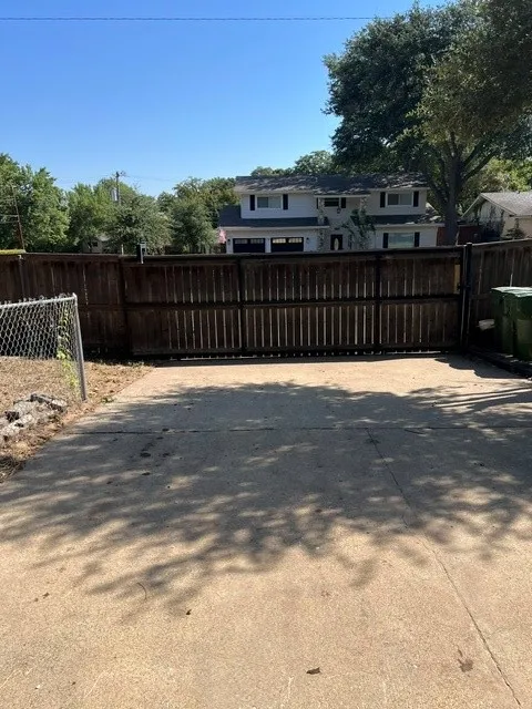 fenced in drive way. corner lot