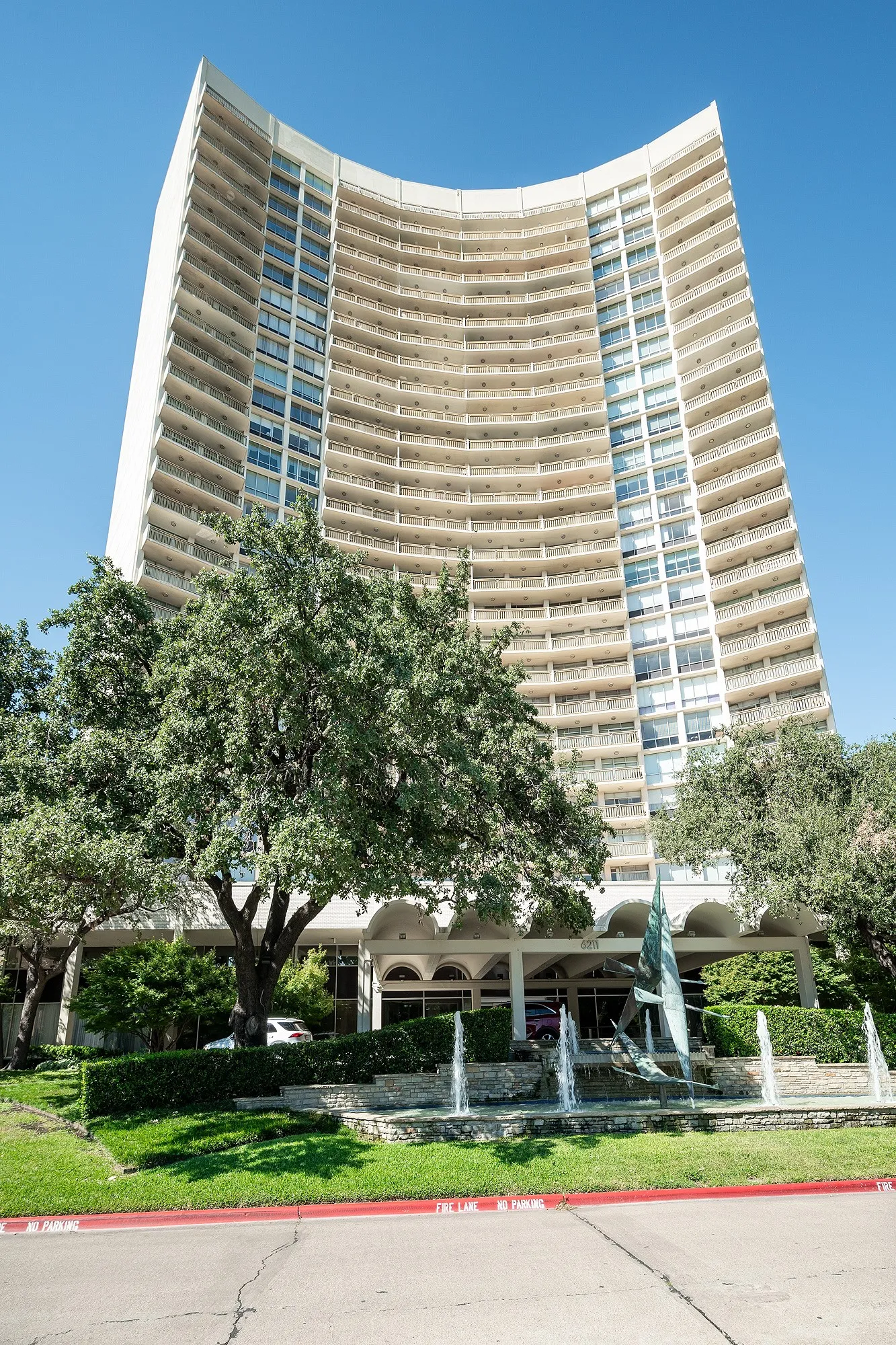Porte cochere and circular driveway accent classic architecture.