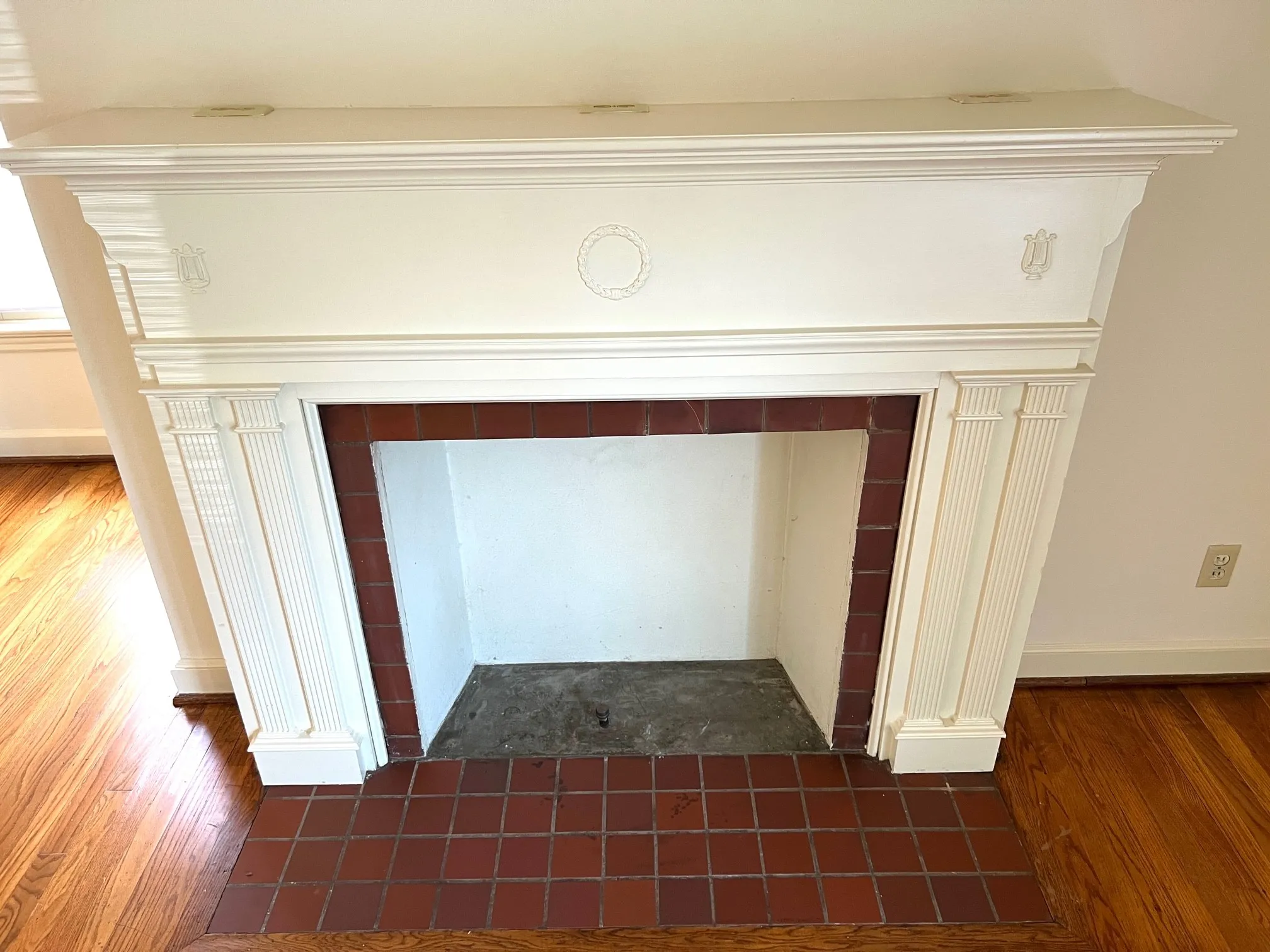 Decorative fireplace mantle with electrical outlets