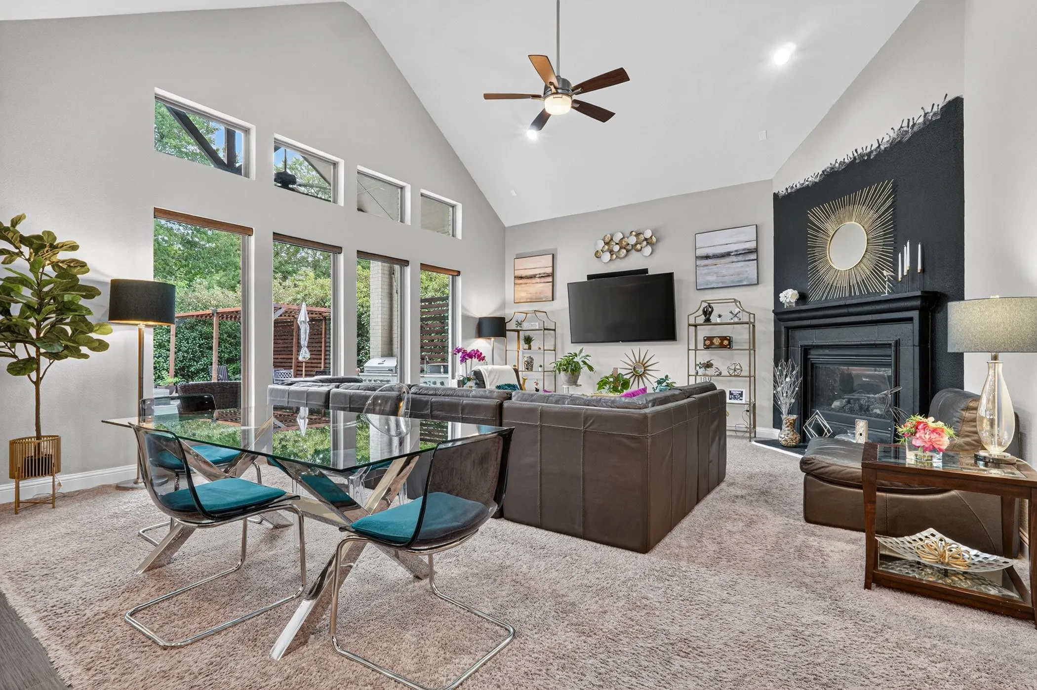Soaring vaulted ceilings complement the expansive wall of windows