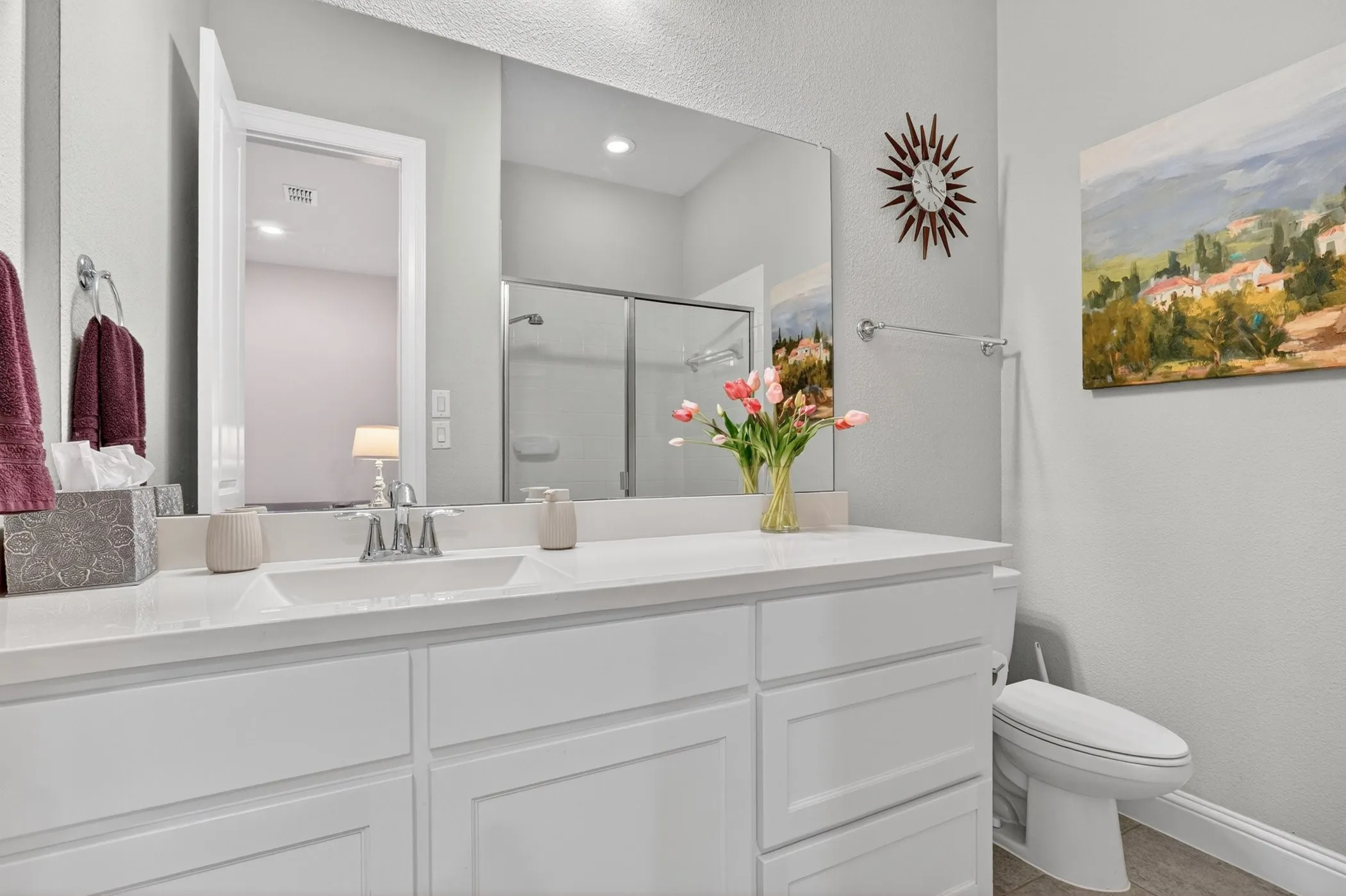 Dual vanity with undermount sinks and white countertops