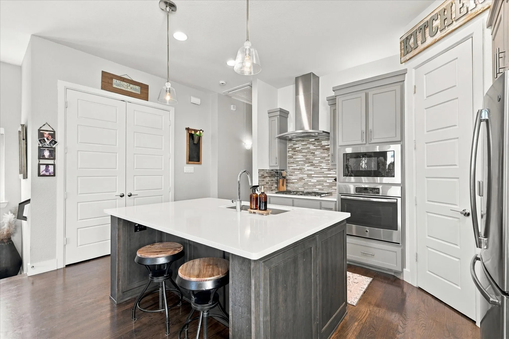 The large kitchen island is perfect for a quick meal or chatting with the cook.