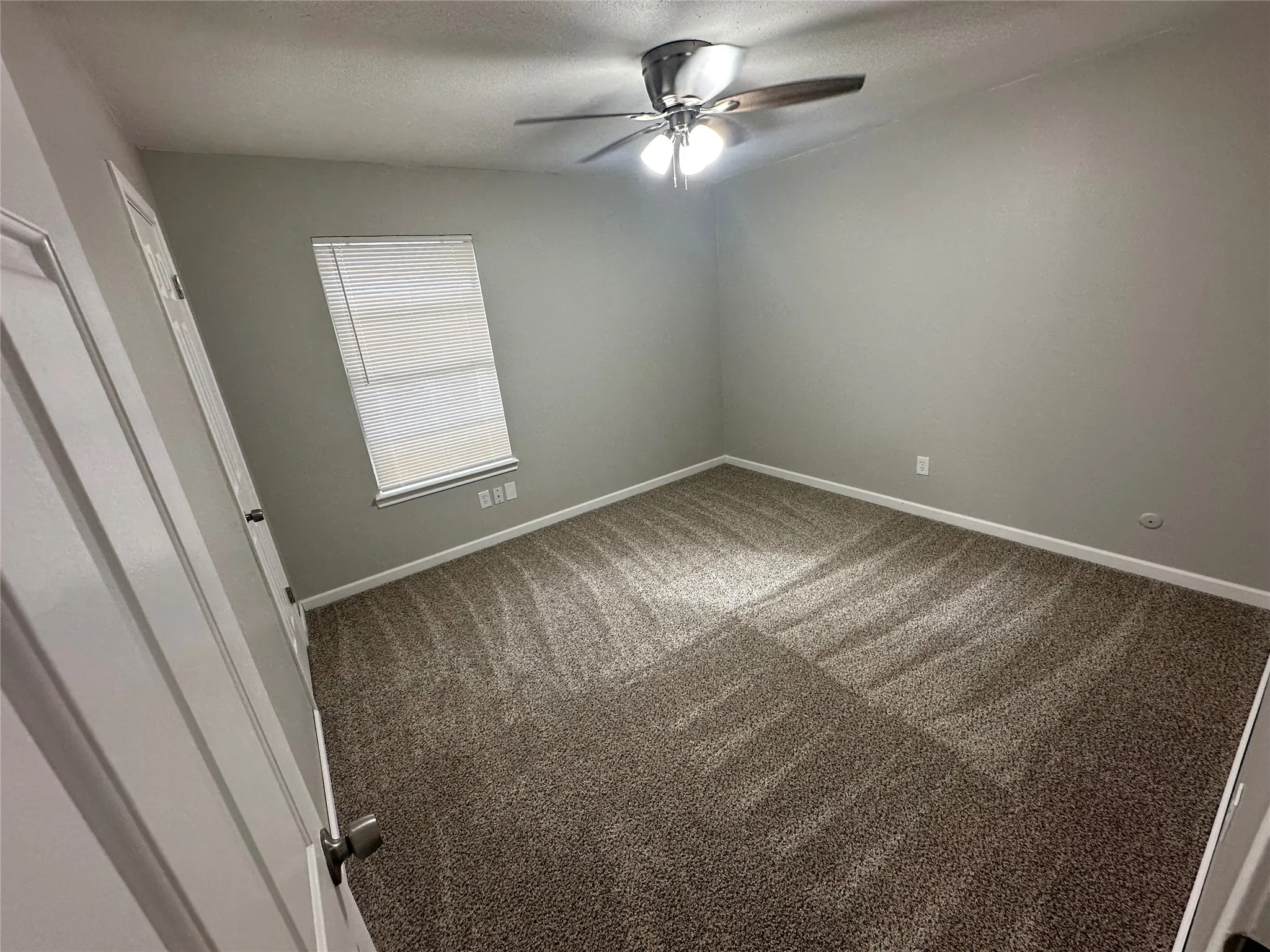 Wall-to-wall carpeting and neutral wall tones