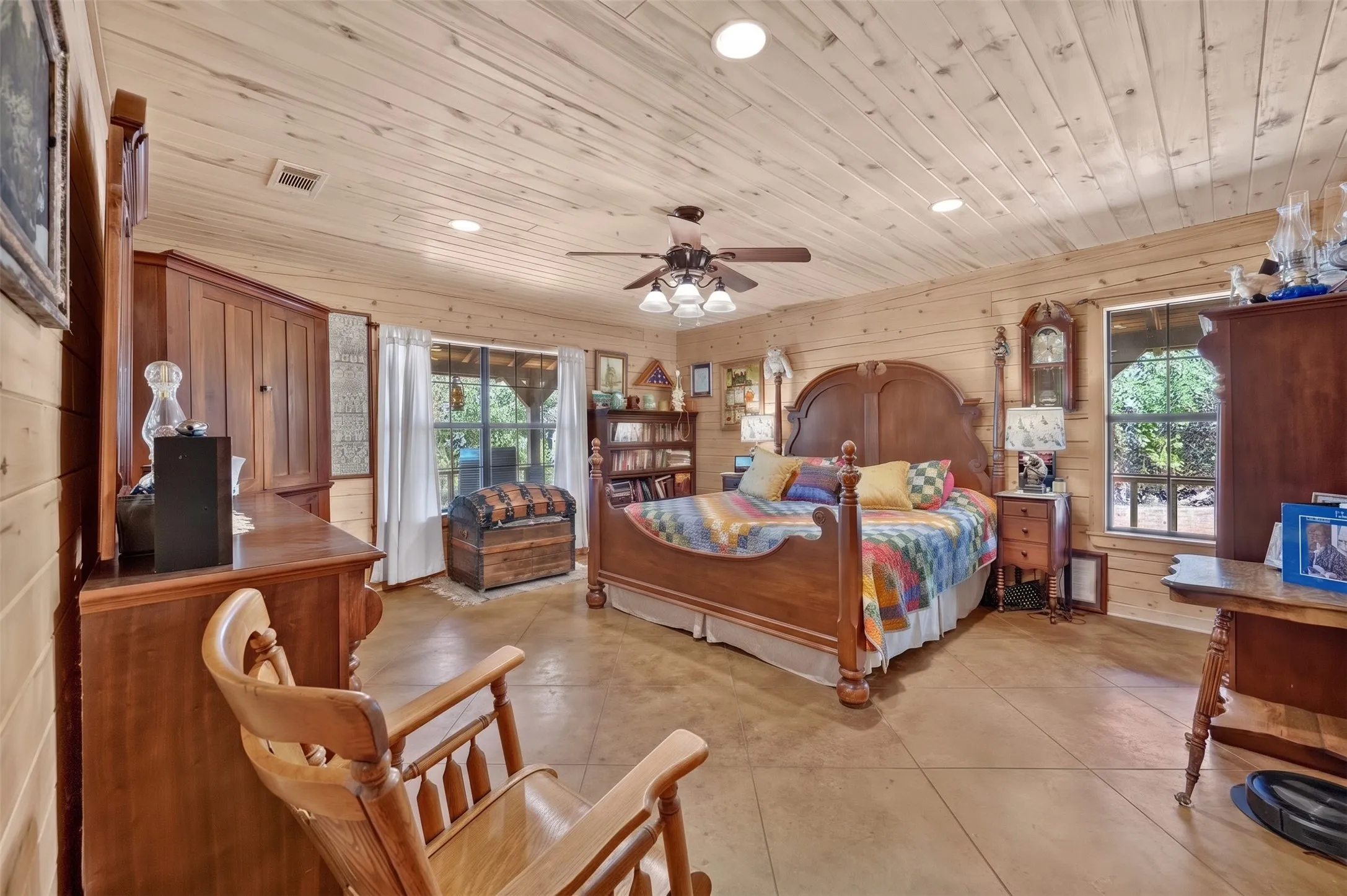 Wood-paneled walls and ceiling with recessed lighting
