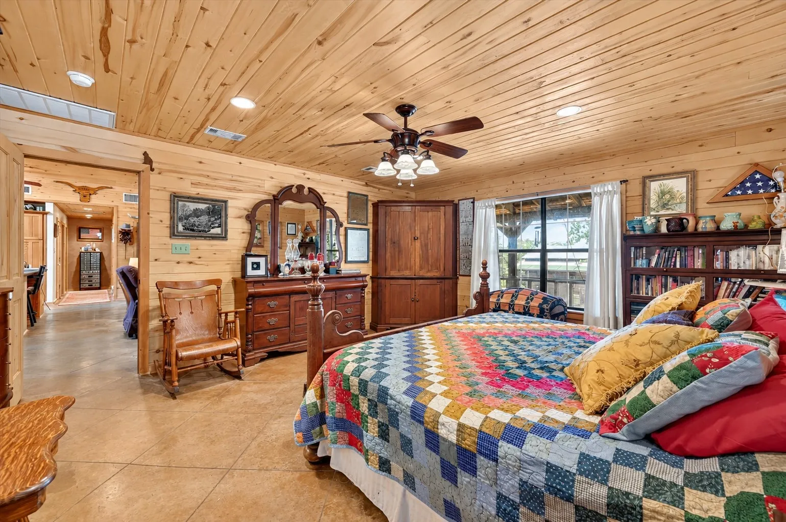 Wood-paneled walls and ceiling with recessed lighting