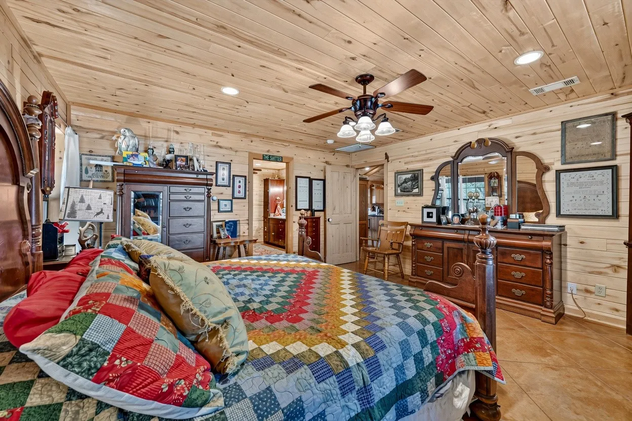 Wood-paneled walls and ceiling, recessed lighting, ceiling fan with light fixture, and wood-finish flooring