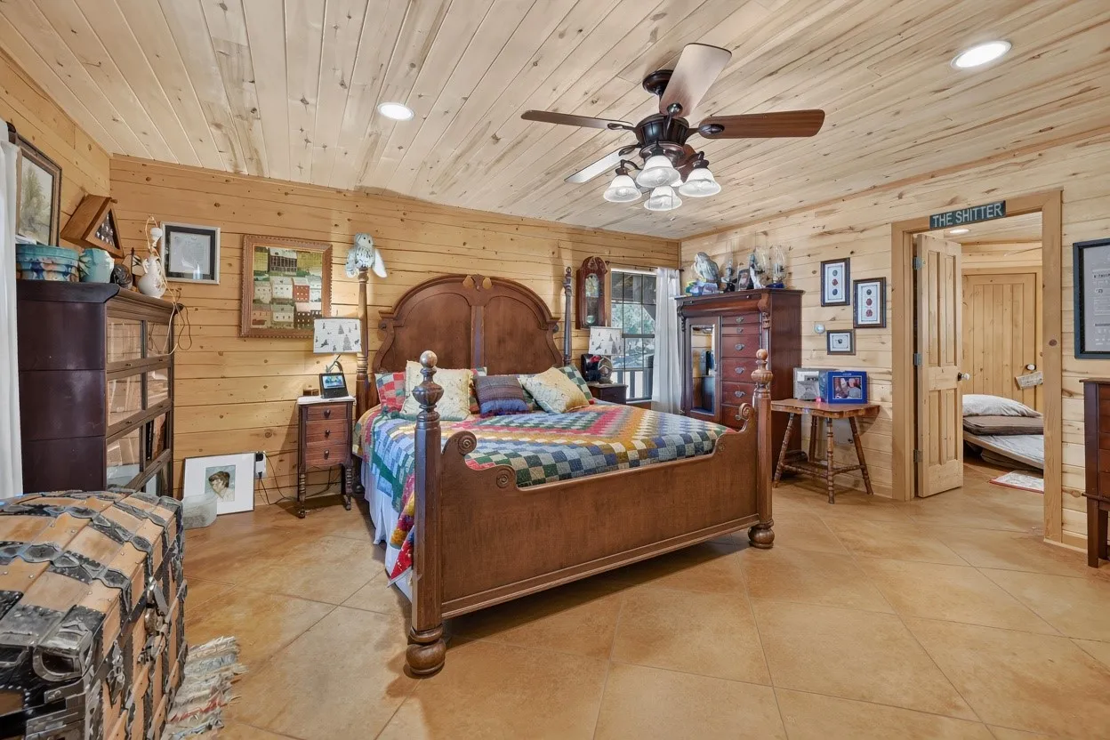 Wood-paneled walls and ceiling with recessed lighting